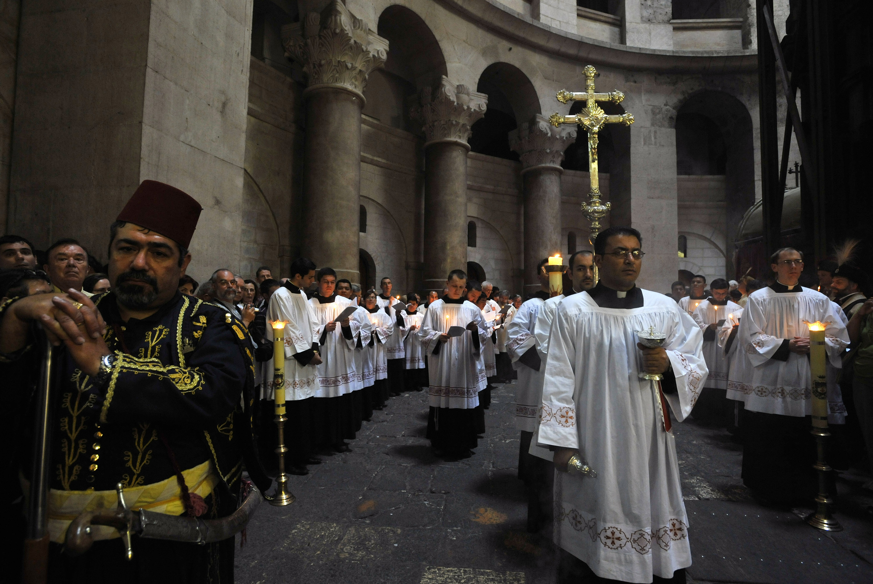 Catholic clergy take part in a procession during Easter Mass at the Church of the Holy Sepulchre in Jerusalem's Old City March 23, 2008