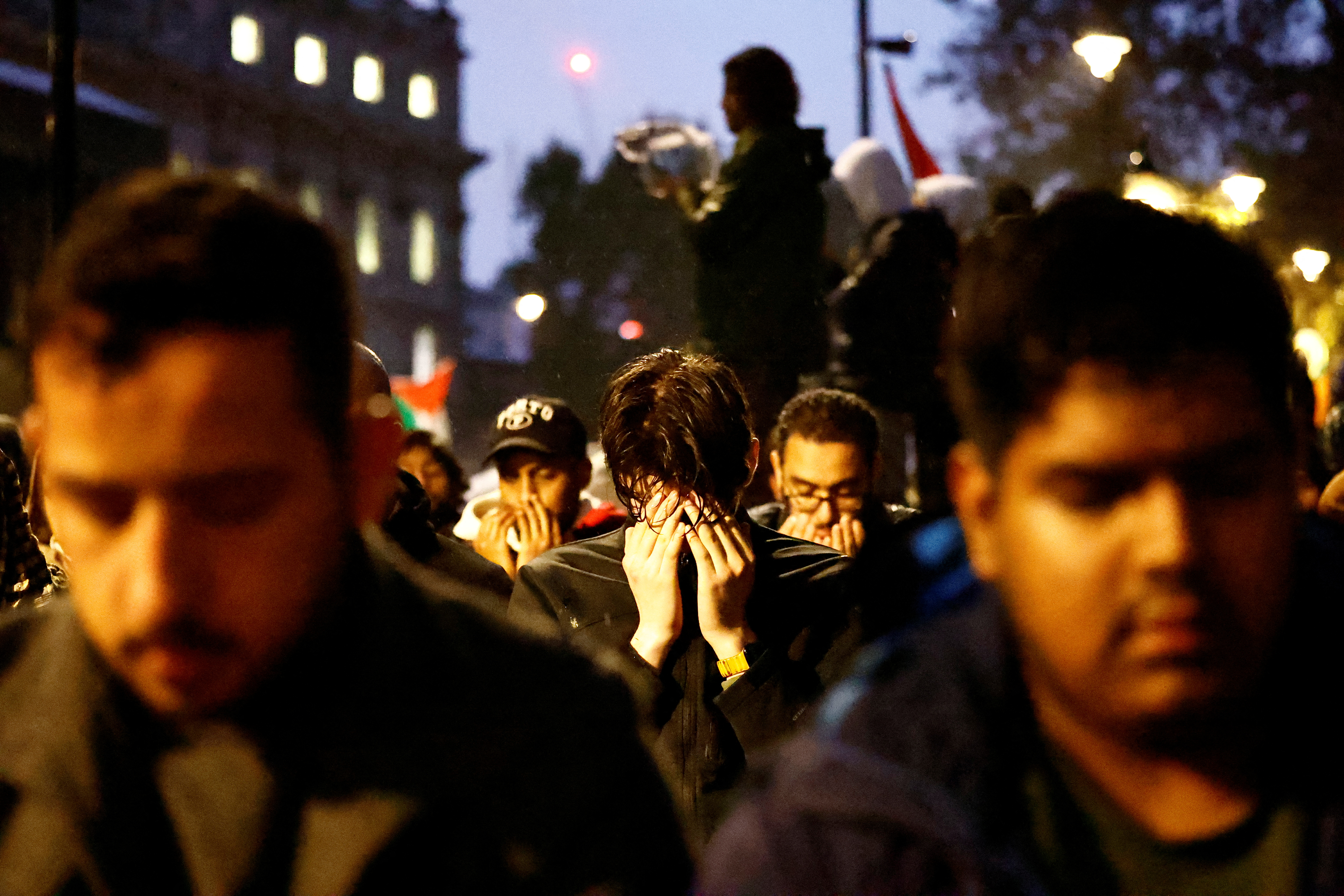 Muslims pray at a demonstration in support of Palestinians outside Downing Street