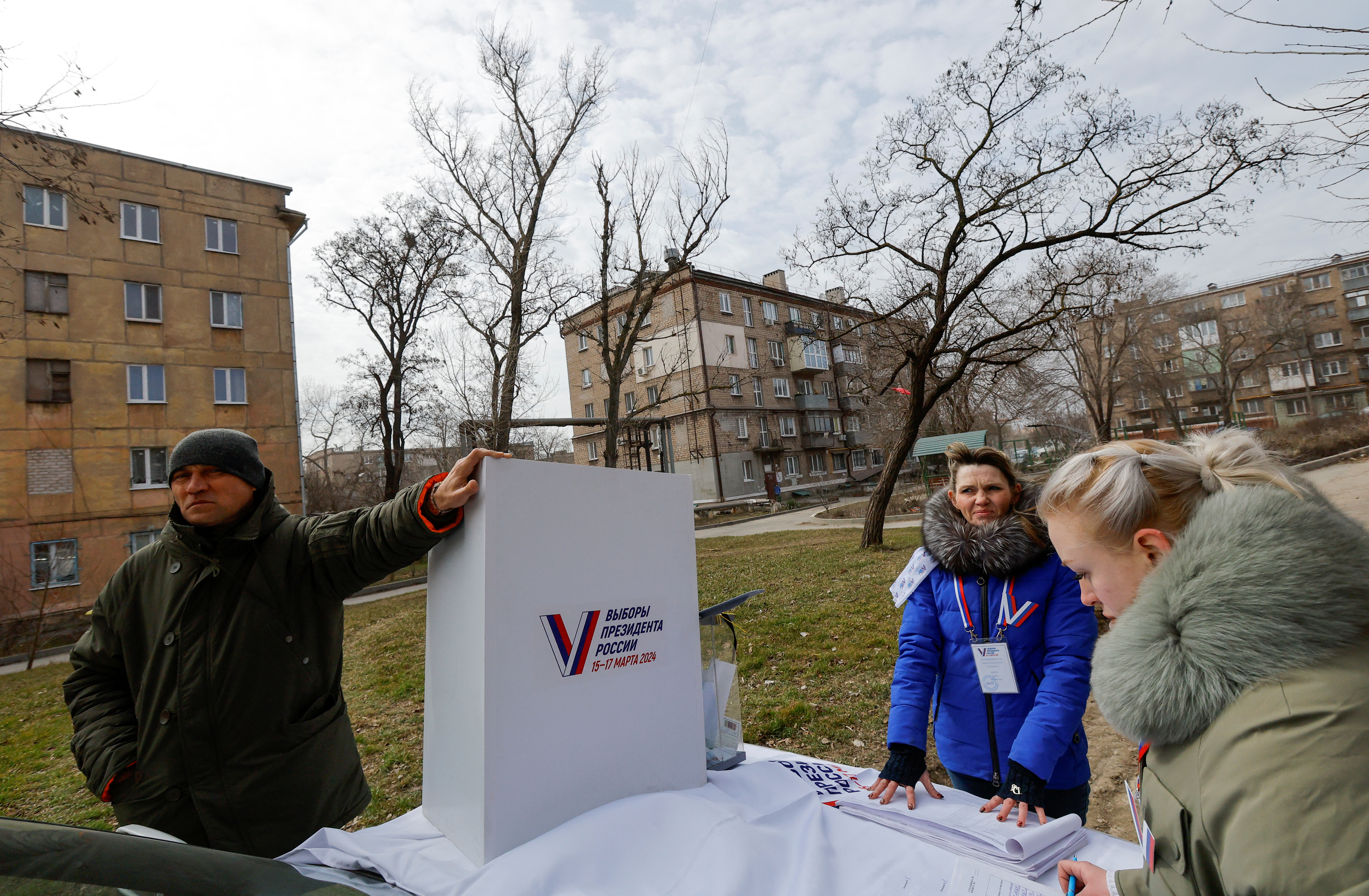 Members of a local electoral commission work at a mobile polling station during the early voting in Russia’s presidential election, in the course of Russia-Ukraine conflict in Mariupol, Russian-controlled Ukraine, March 13, 2024. REUTERS/Alexander Ermochenko