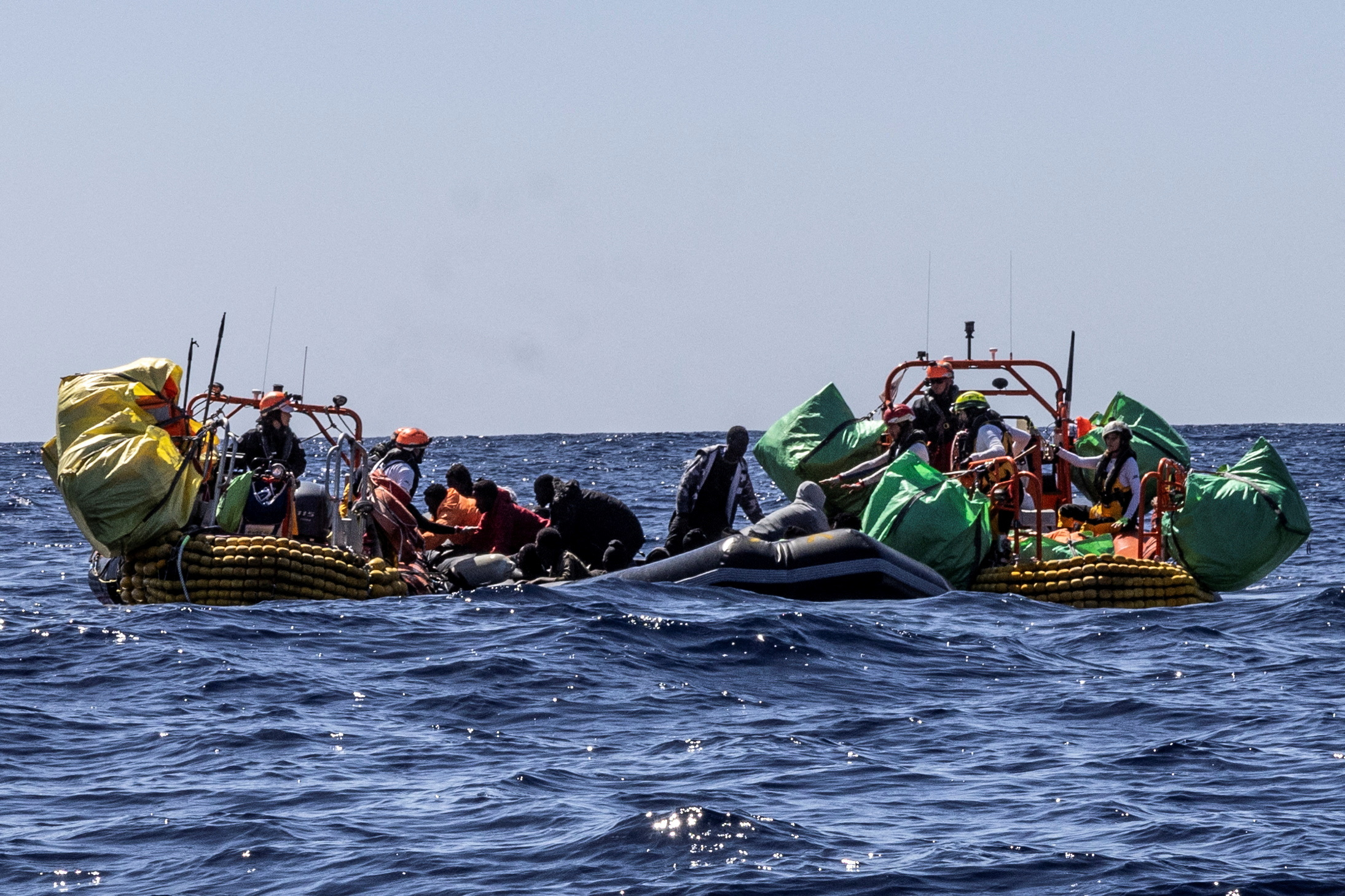 Migrants are rescued by crew members of the rescue ship Ocean Viking