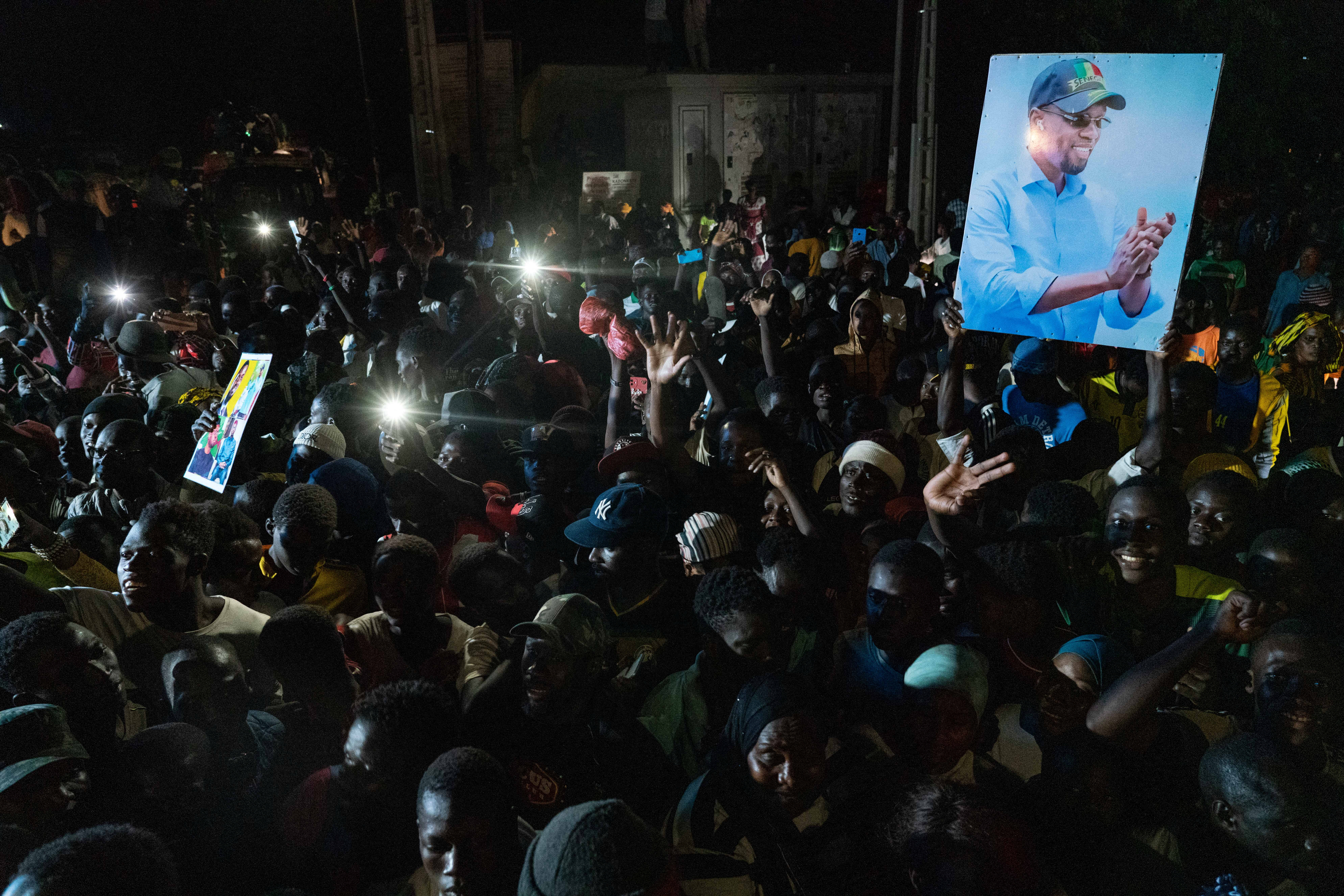Supporters of Senegalese opposition leader Ousmane Sonko attend an electoral campaign caravan of Bassirou Diomaye Faye, the presidential candidate who is backed by Sonko, in the March 24 election, in Zinguichor, Casamance, Senegal March 17, 2024. REUTERS/Abdou Karim Ndoye