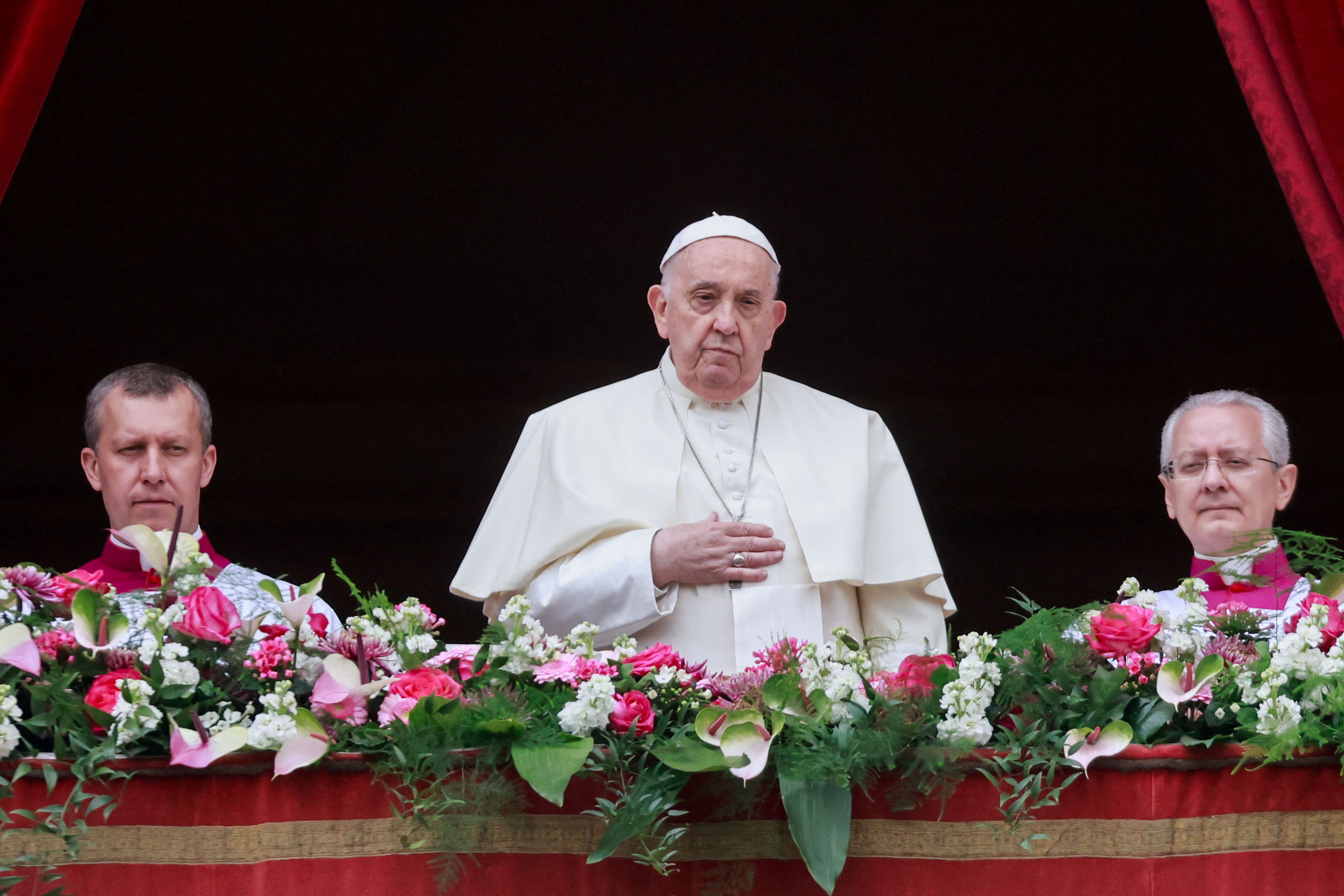 Pope Francis looks on from a balcony, on the day he delivers his "Urbi et Orbi" (To the city and the world) message at St. Peter's Square, on Easter Sunday, at the Vatican March 31, 2024. REUTERS/Yara Nardi