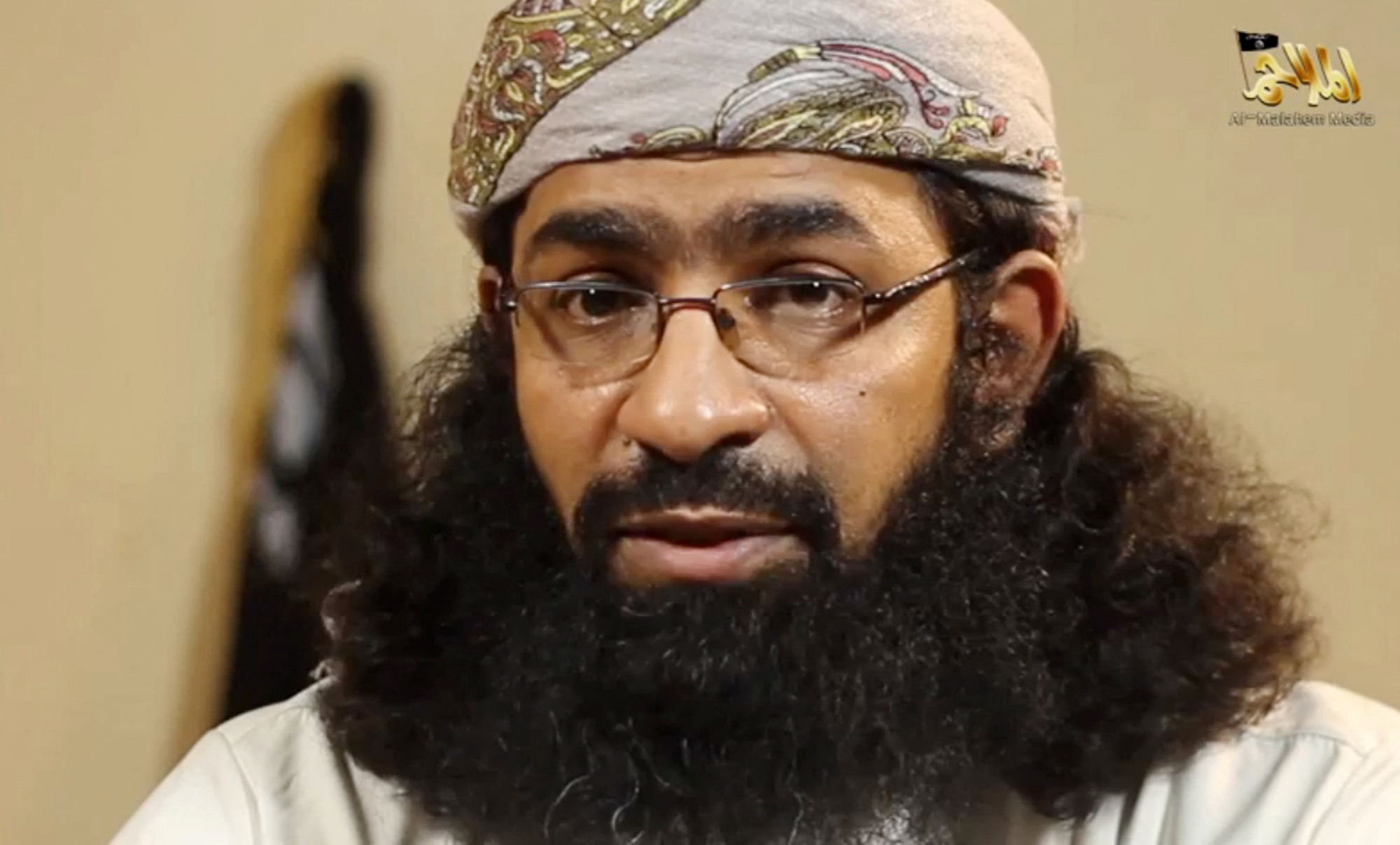 An image grab taken from a video released by Al-Malahem Media, the media arm of Al-Qaeda in the Arabian Peninsula (AQAP), shows Khaled Omar Batarfi (also known as Abu Meqdad al-Kindi) a spokesman for AQAP announcing in a video posted online on June 15, 2015