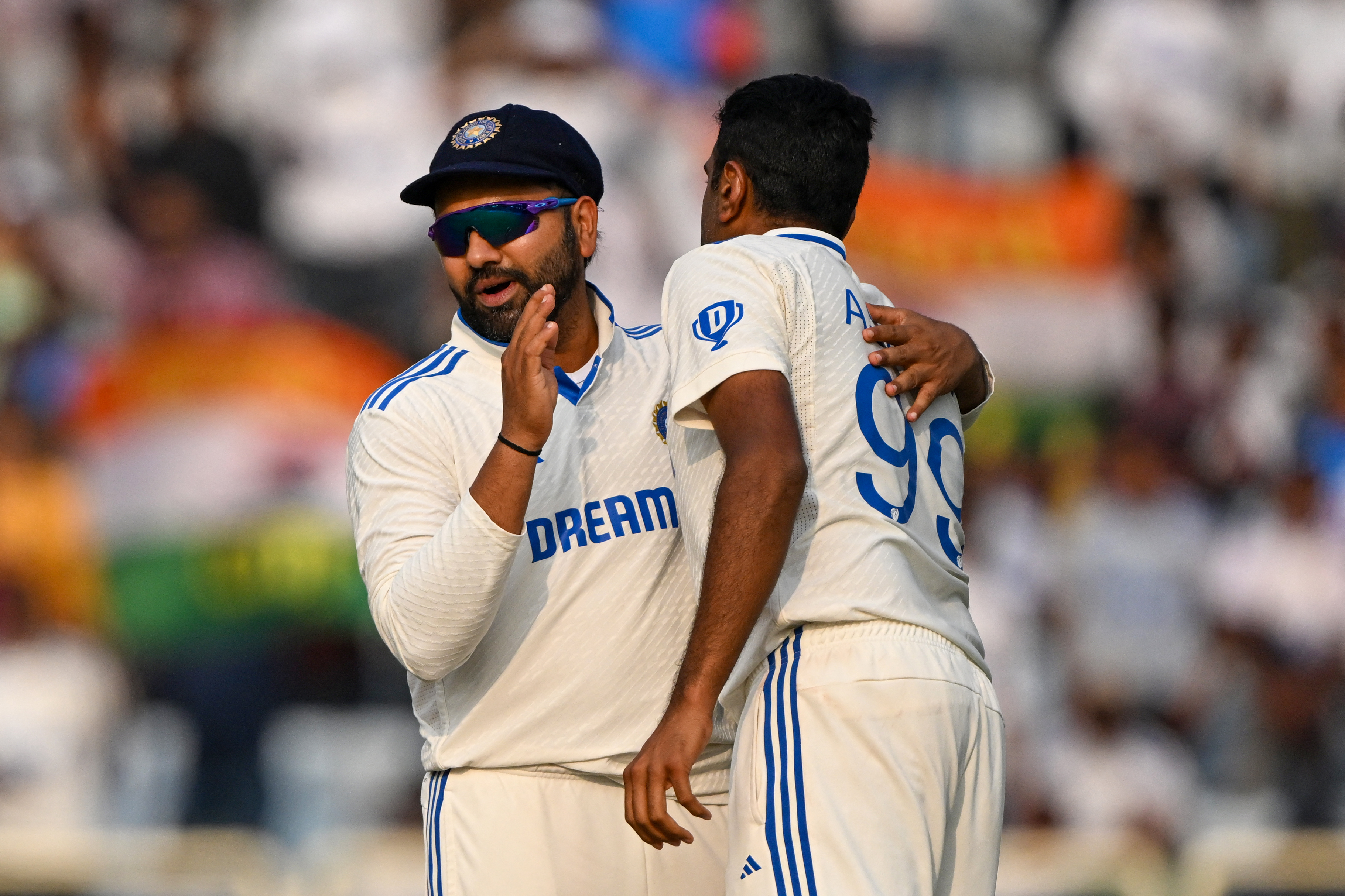 India's Ravichandran Ashwin (R) celebrates with captain Rohit Sharma after the dismissal of England's Ben Foakes during the third day of the fourth Test cricket match between India and England at the Jharkhand State Cricket Association (JSCA) Stadium in Ranchi on February 25, 2024. (Photo by TAUSEEF MUSTAFA / AFP) / -- IMAGE RESTRICTED TO EDITORIAL USE - STRICTLY NO COMMERCIAL USE -- - -- IMAGE RESTRICTED TO EDITORIAL USE - STRICTLY NO COMMERCIAL USE --