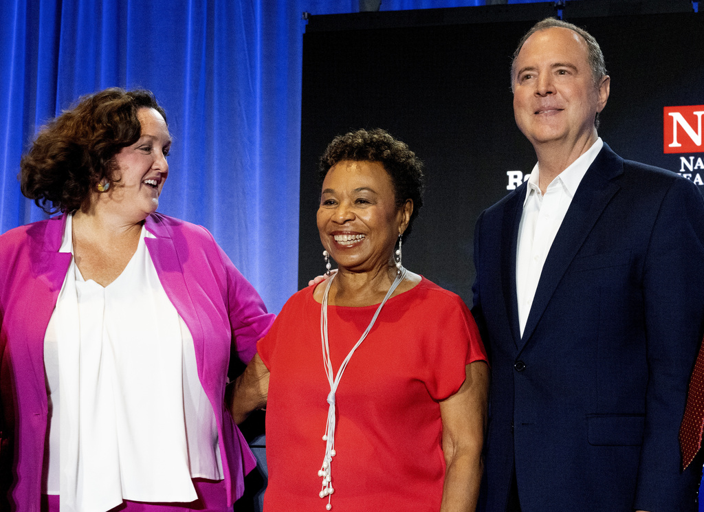 Katie Porter in a pink and white, Barbara Lee in a red shit and Adam Schiff with a black suit and a white shirt 