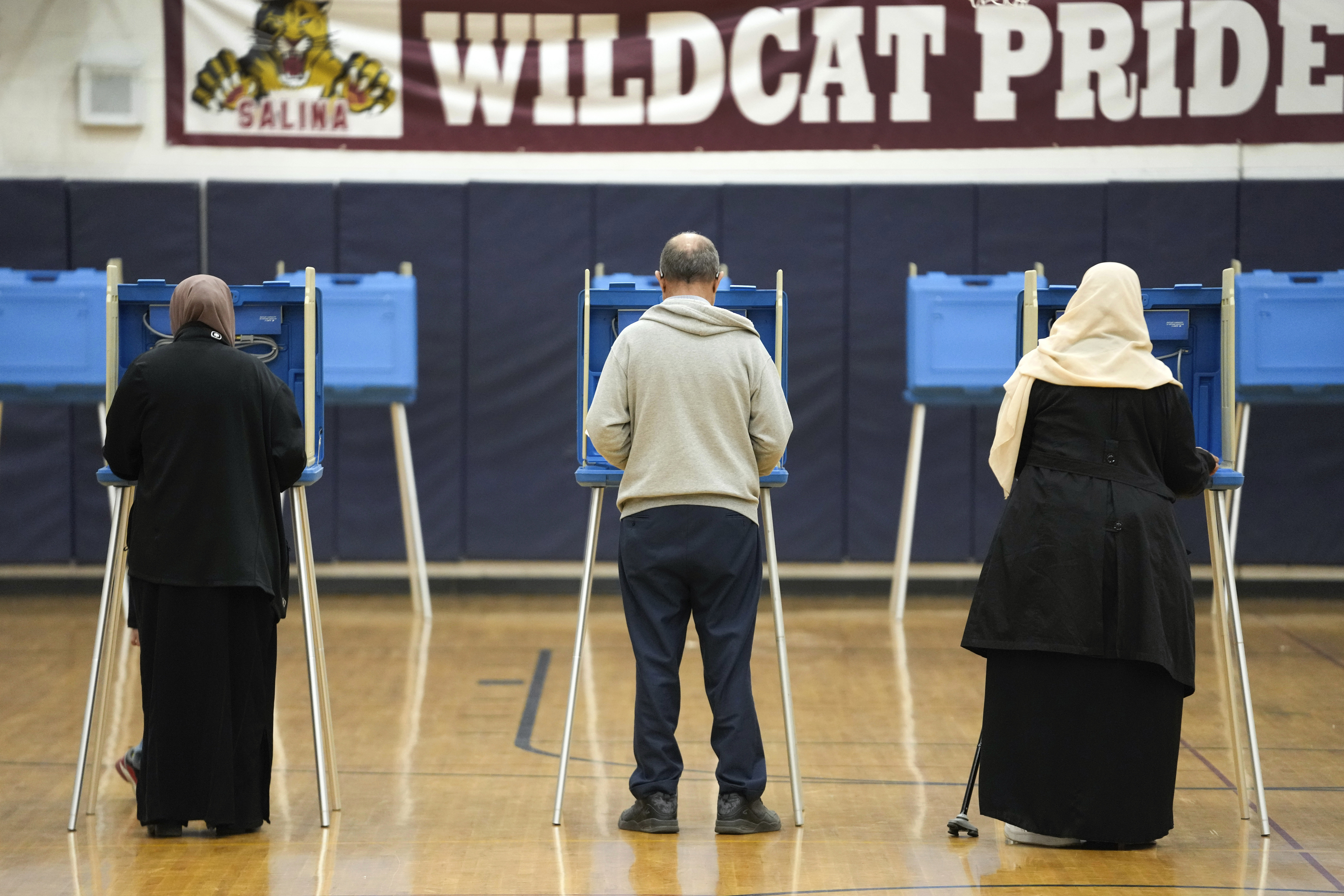 Voters fill out their ballot for the Michigan primary election in Dearborn, Mich., Tuesday, Feb. 27, 2024. Michigan is the last major primary state before Super Tuesday and a critical swing state in November's general election. (AP Photo/Paul Sancya)