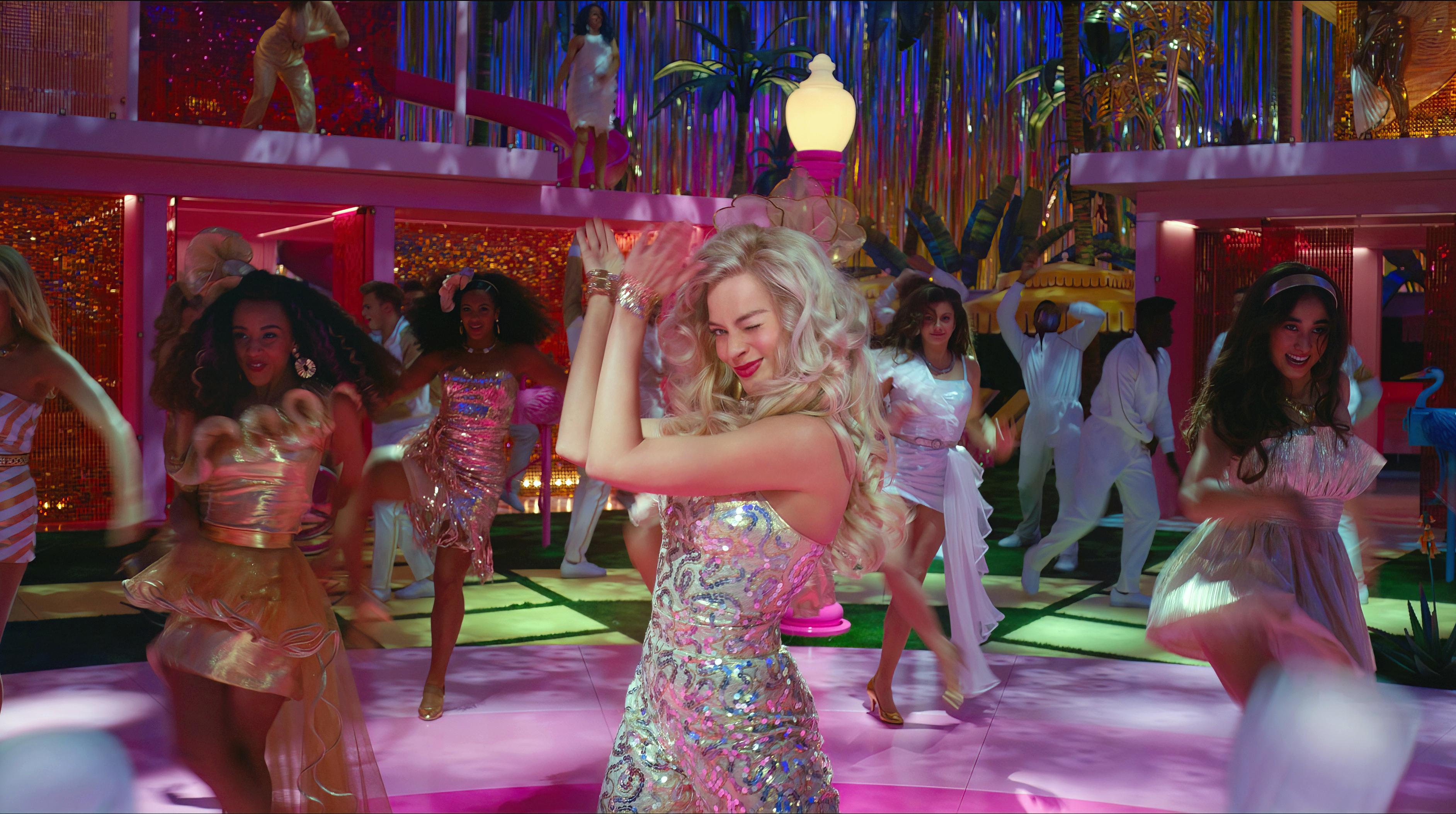 Margot Robbie dances in a disco-like setting in Barbie