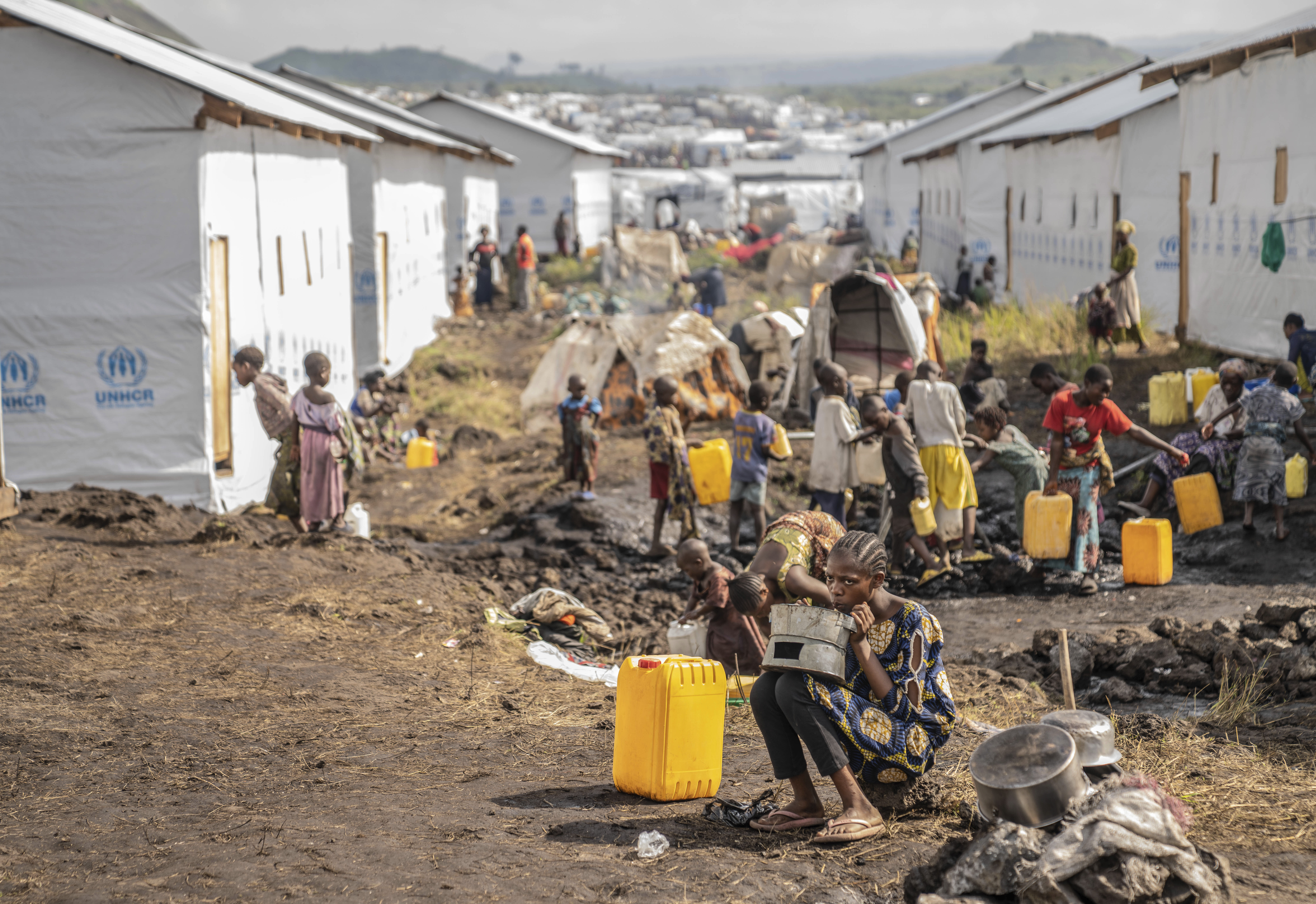 People displaced by the ongoing fighting between Congolese forces and M23 rebels gather in a camp on the outskirts of Goma, Democratic Republic of Congo, Wednesday, March 13