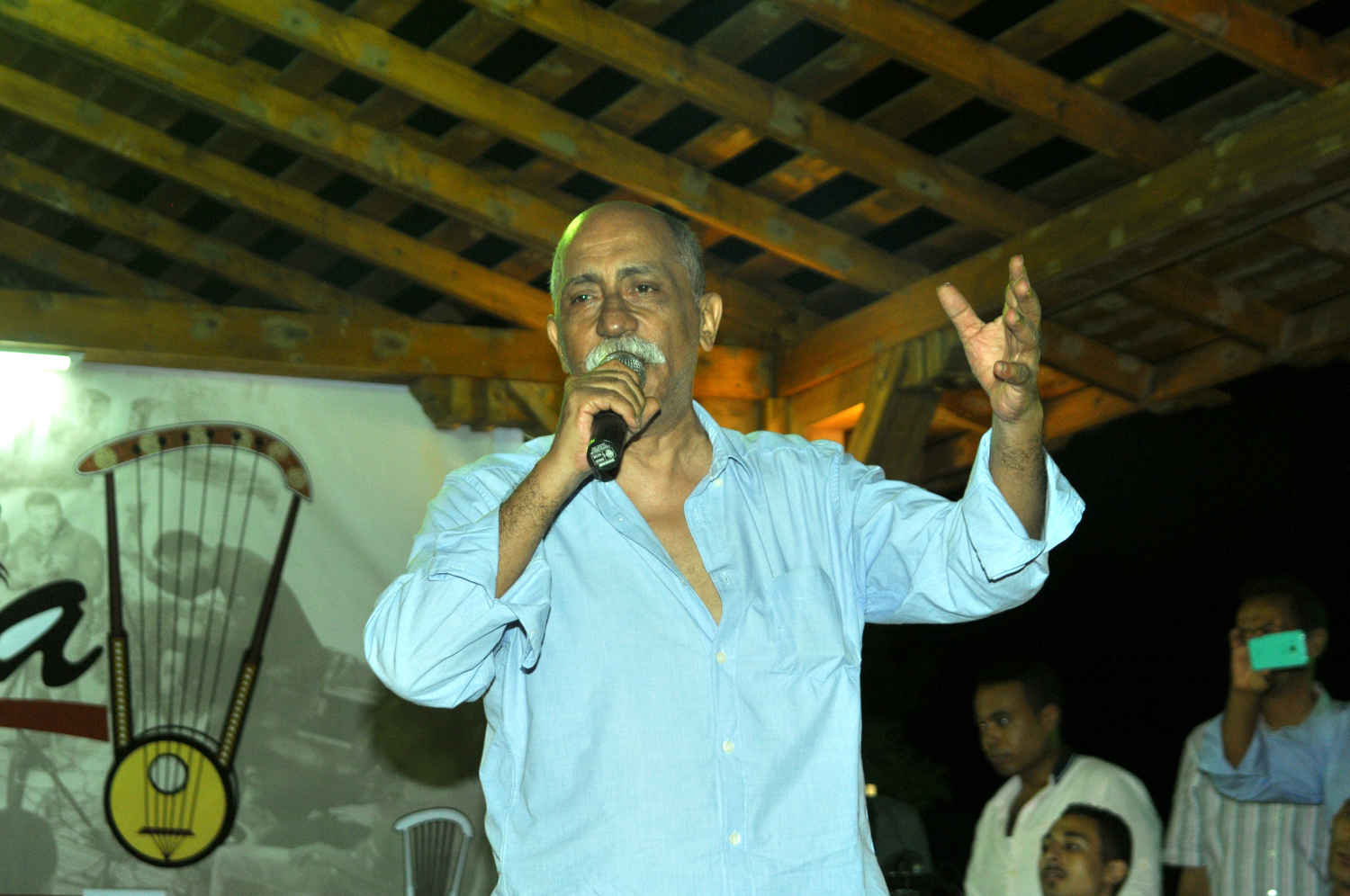 Zakaria speaking wearing a light blue shrt