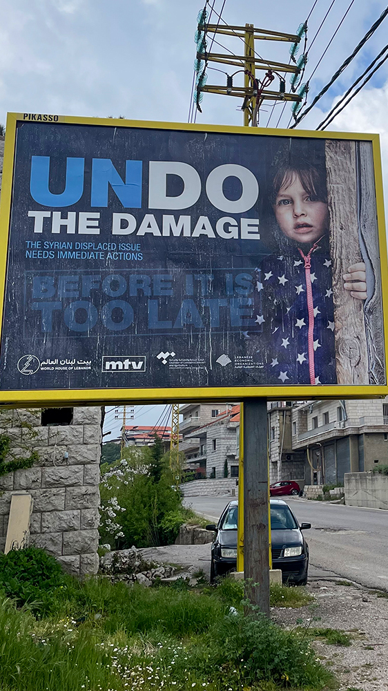 A billboard in the village of Mrouj carries an anti-Syrian refugee message