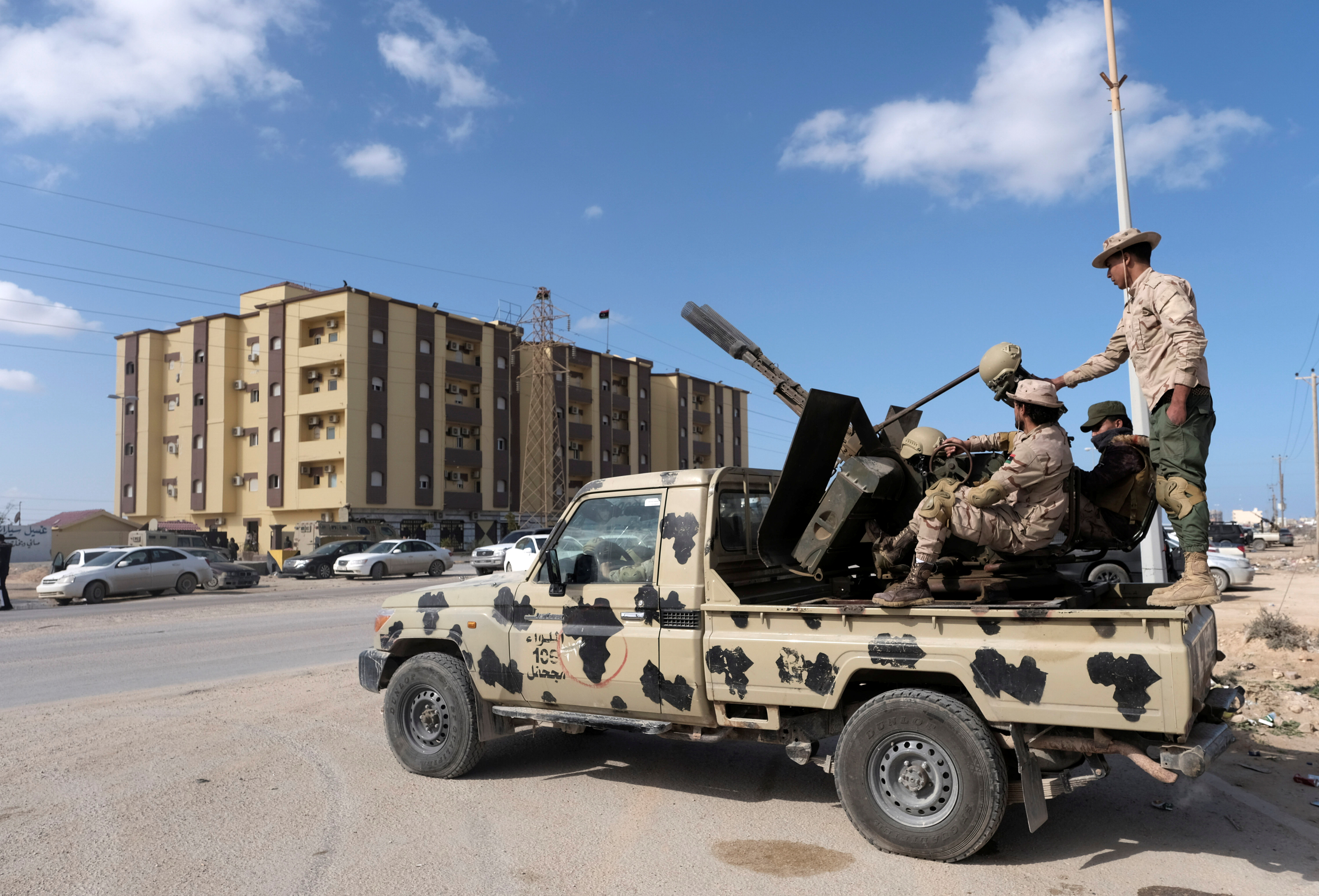 Security forces stand guard outside the Parliament building, in Tobruk