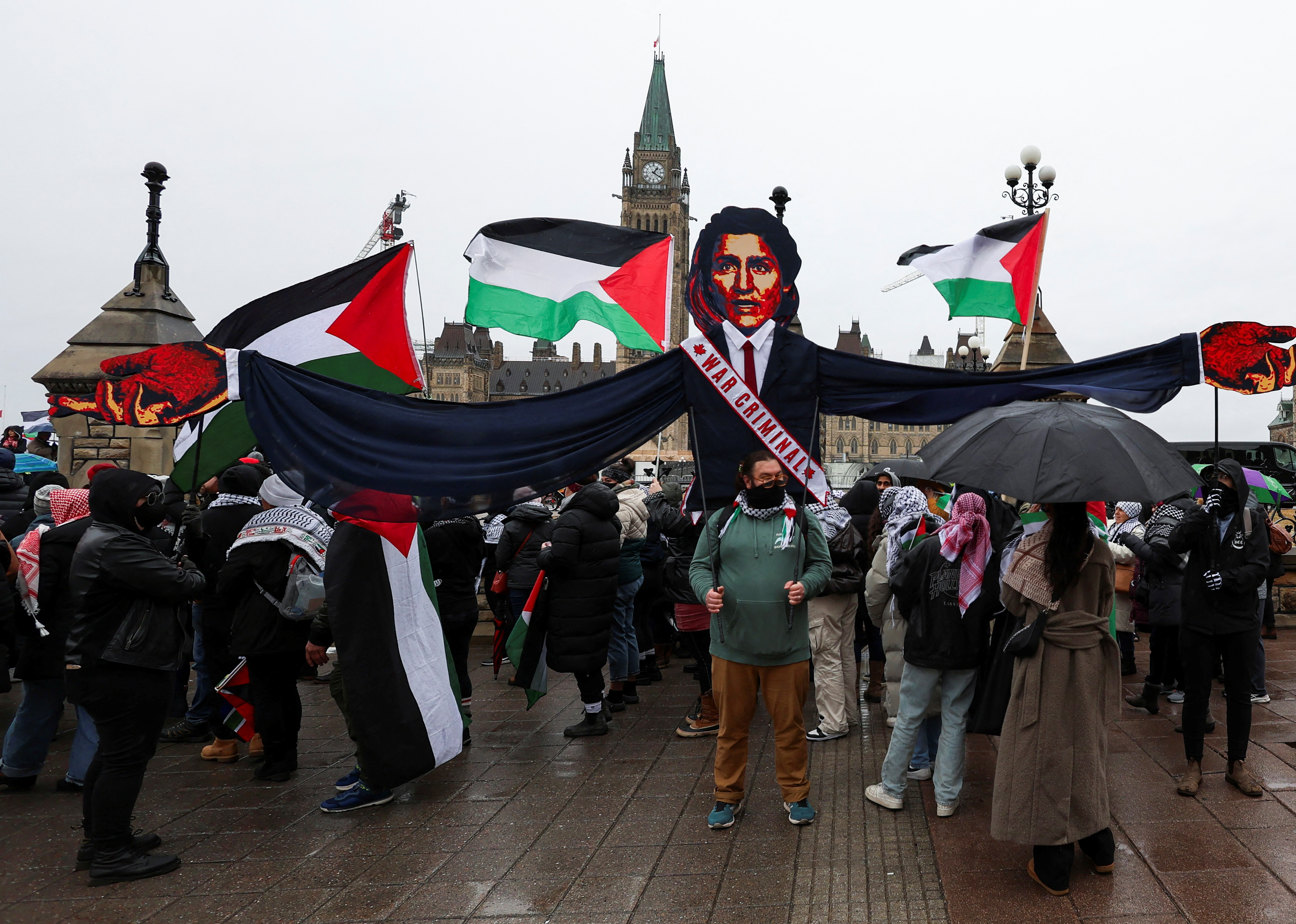 Protesters hold an effigy of Canadian Prime Minister Justin Trudeau at a rally demanding a ceasefire in Gaza