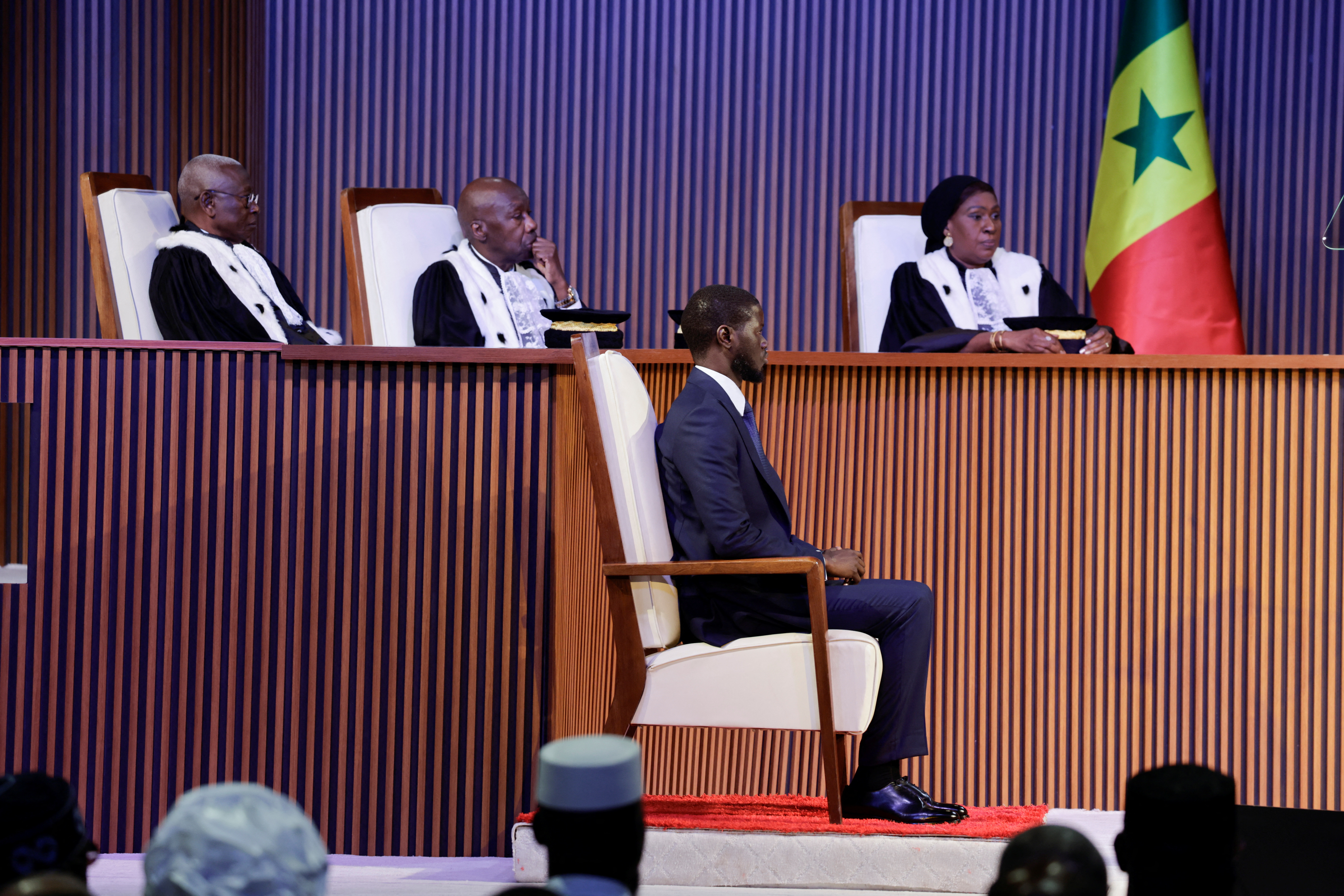 Senegal's Newly elected president Bassirou Diomaye Faye sits before he takes the oath