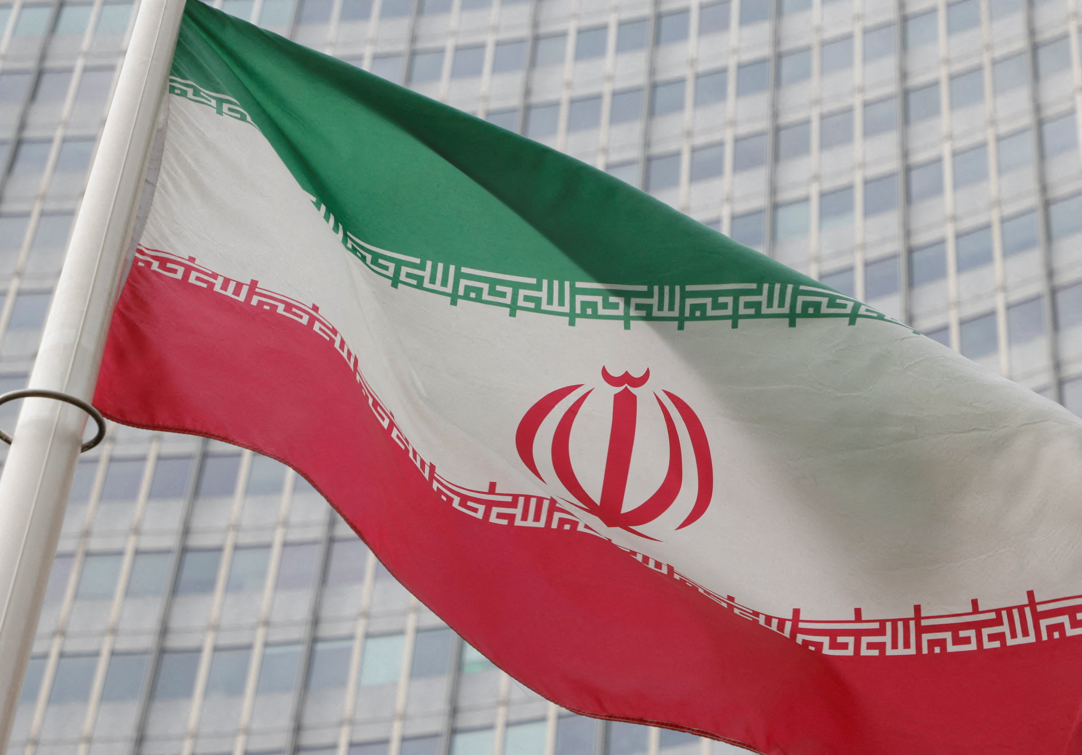 The Iranian flag flutters outside the International Atomic Energy Agency (IAEA) headquarters in Vienna, Austria on March 6, 2023.