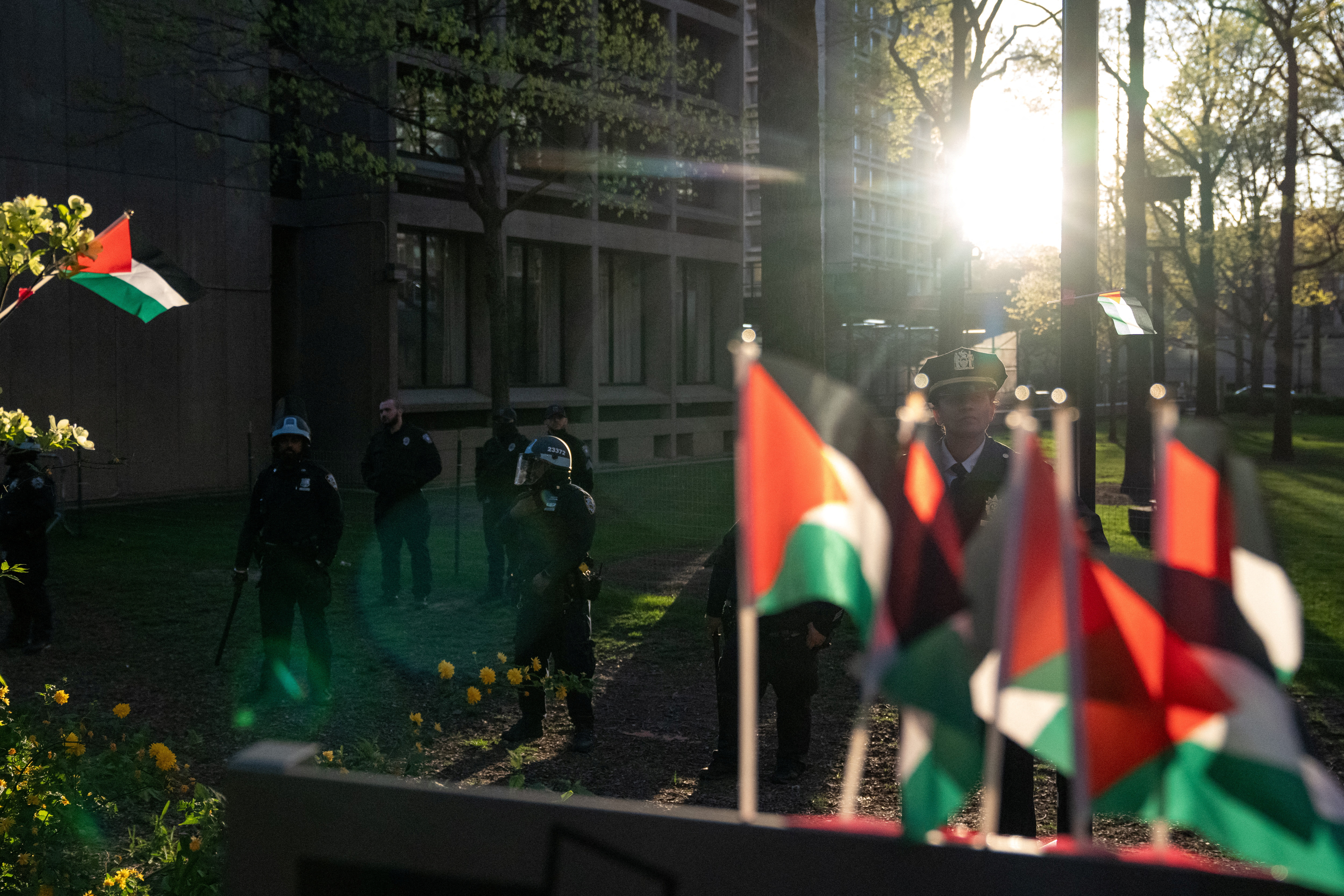Law enforcement officers stand guard as students and pro-Palestinian supporters occupy a plaza at New York University (NYU) campus, during the ongoing conflict between Israel and the Palestinian Islamist group Hamas, in New York City, U.S., April 26