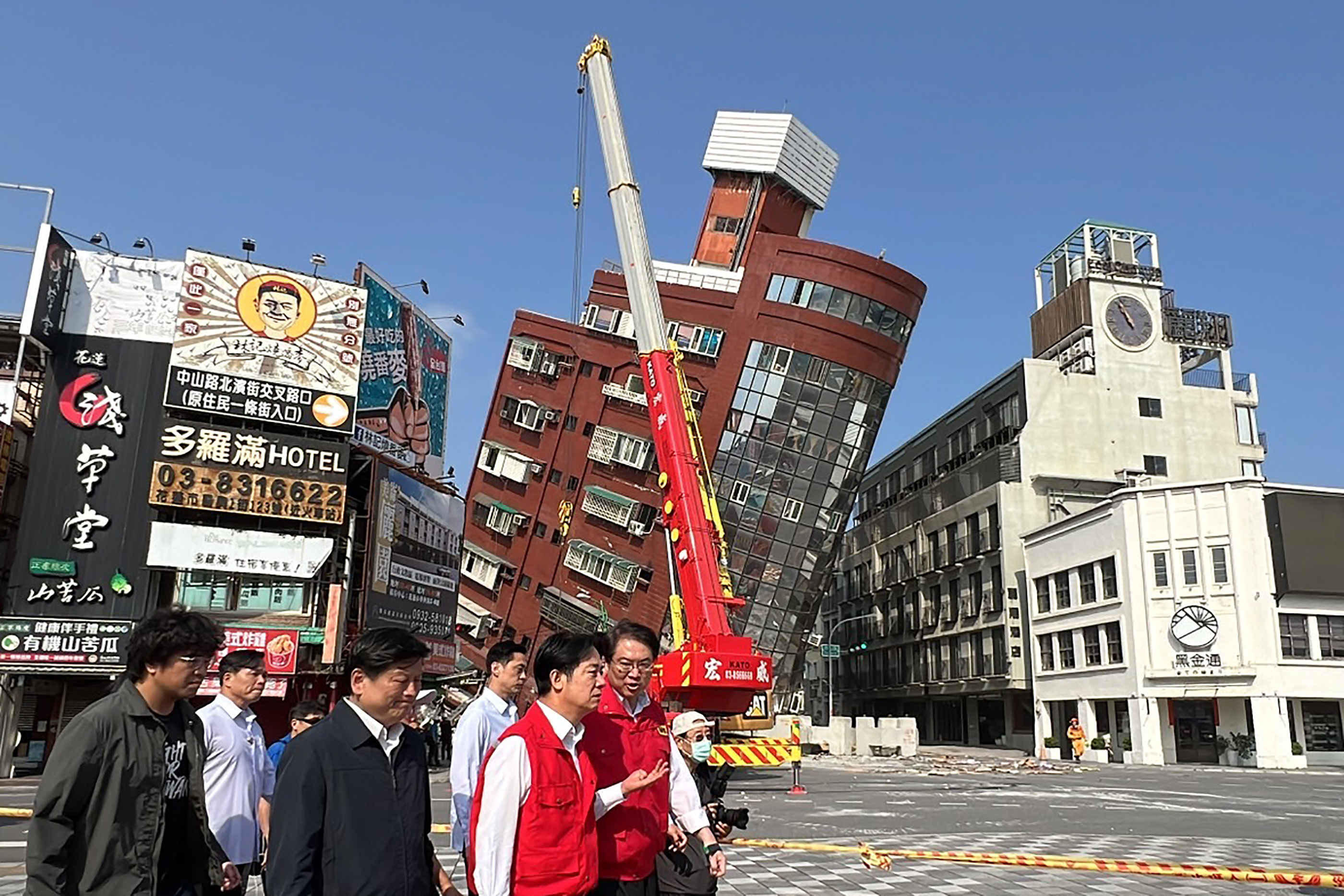 Taiwan's president-elect and current Vice-President Lai Ching-te (3rd R) and other officials survey the damage in Hualien, after a major earthquake hit Taiwan's east, killing at least nine people. (AFP via Central News Agency)