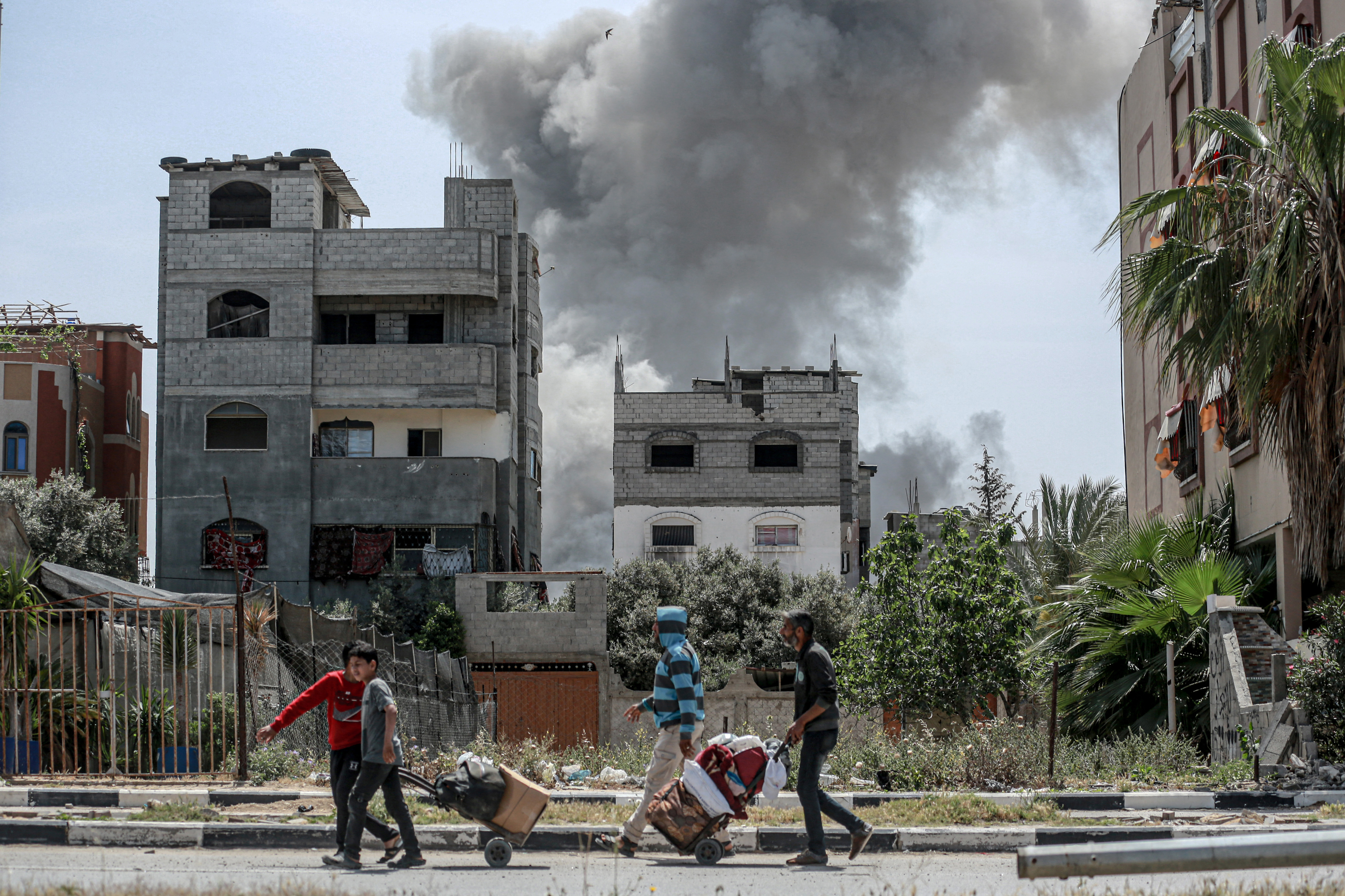 Smoke billows after an Israeli strike on a building in al-Bureij camp in the central Gaza