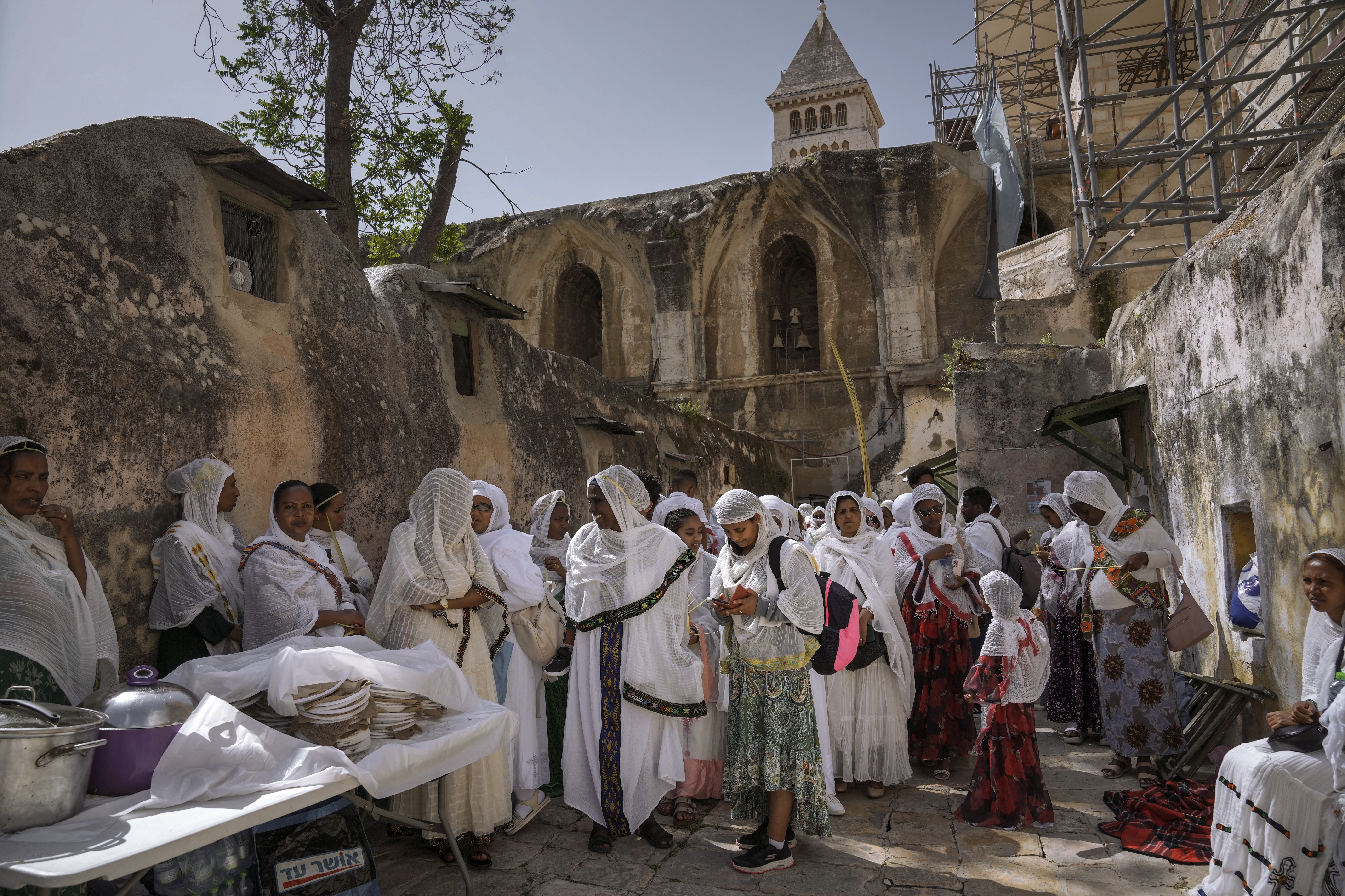 Ethiopian Orthodox Christian worshippers attend the Palm Sunday celebrations at the Ethiopian monks' village Deir Al-Sultan, located on the rooftop of the Church of the Holy Sepulchre where many Christians believe Jesus was crucified, buried and rose from the dead, in the Old City of Jerusalem, Sunday, April 28
