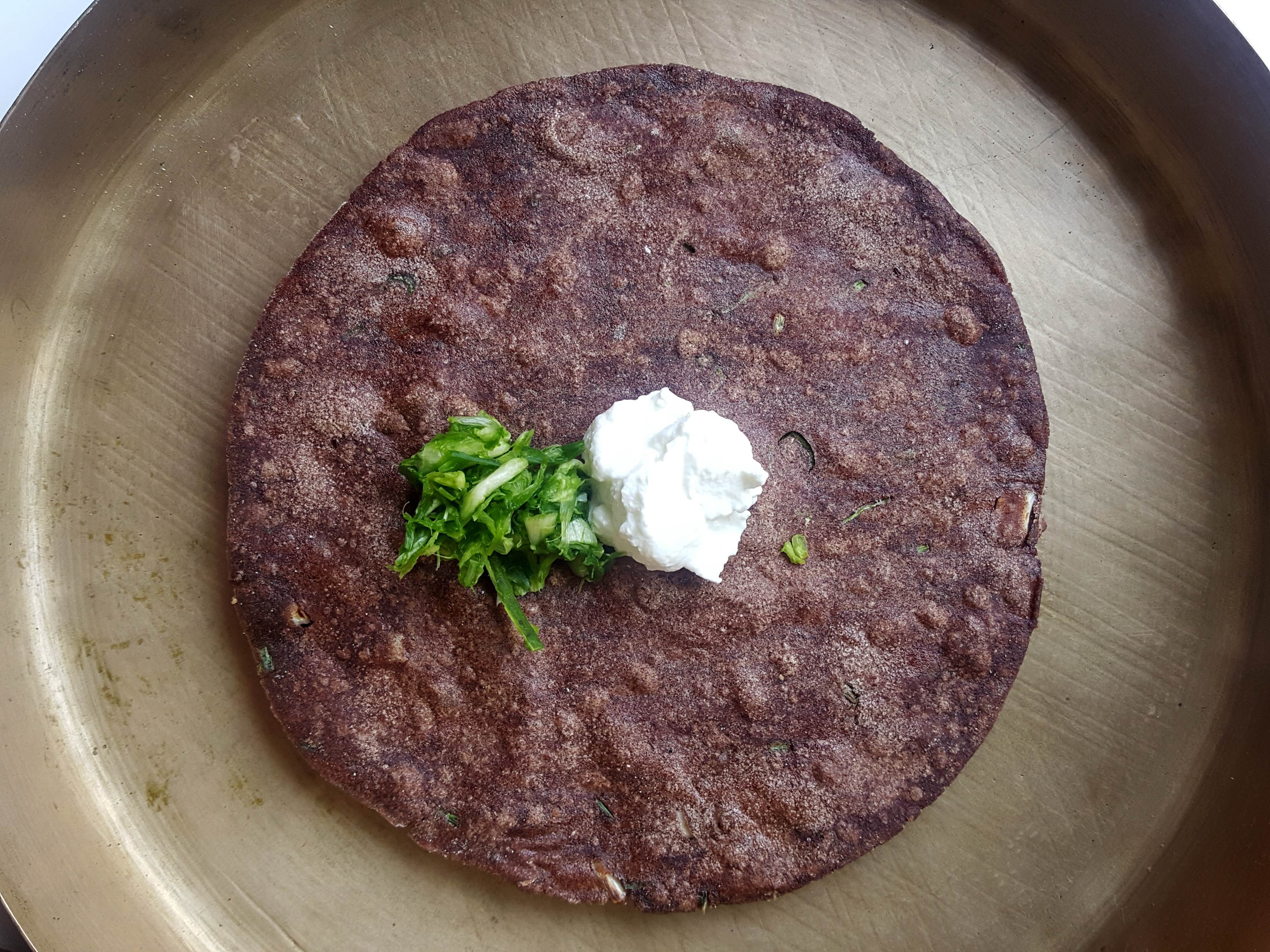 Finger millet roti with white butter and garlic salt [Courtesy of Rushina Ghildiyal]