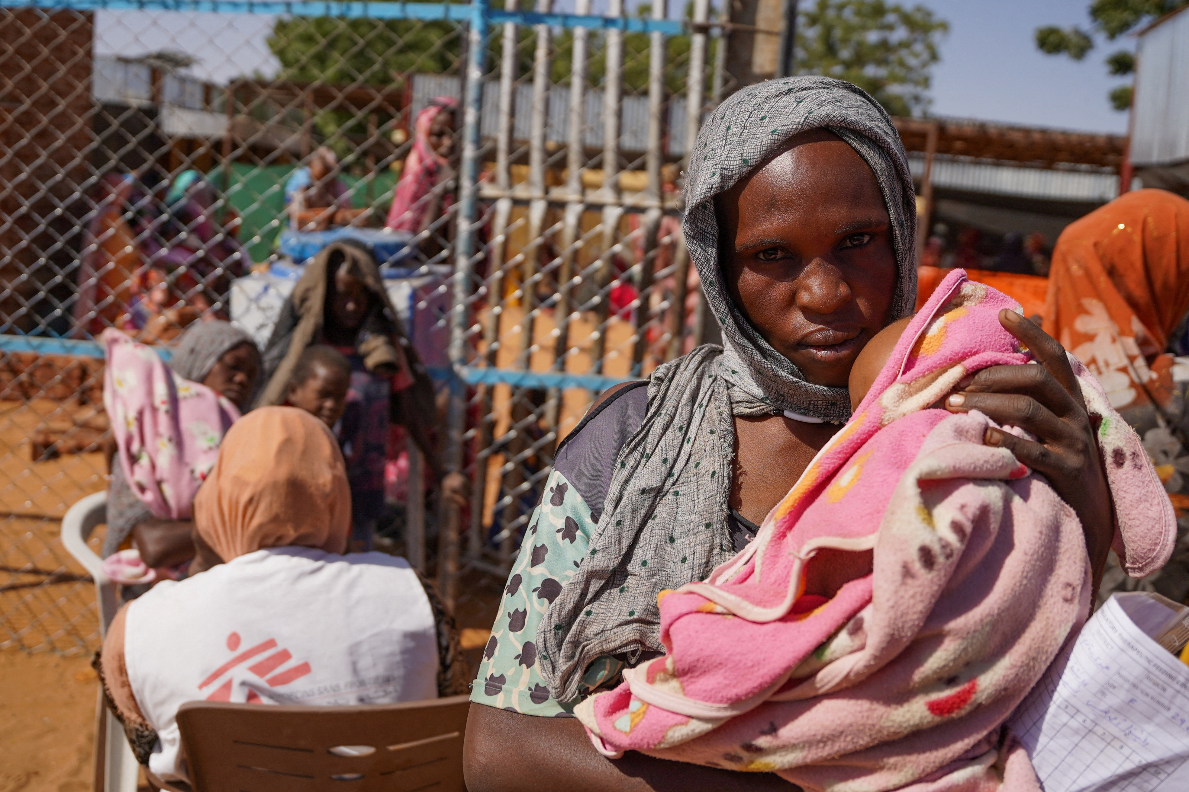 FILE PHOTO: A handout photograph, shot in January 2024, shows a woman and baby at the Zamzam displacement camp, close to El Fasher in North Darfur, Sudan. MSF/Mohamed Zakaria/Handout via REUTERS/File Photo
