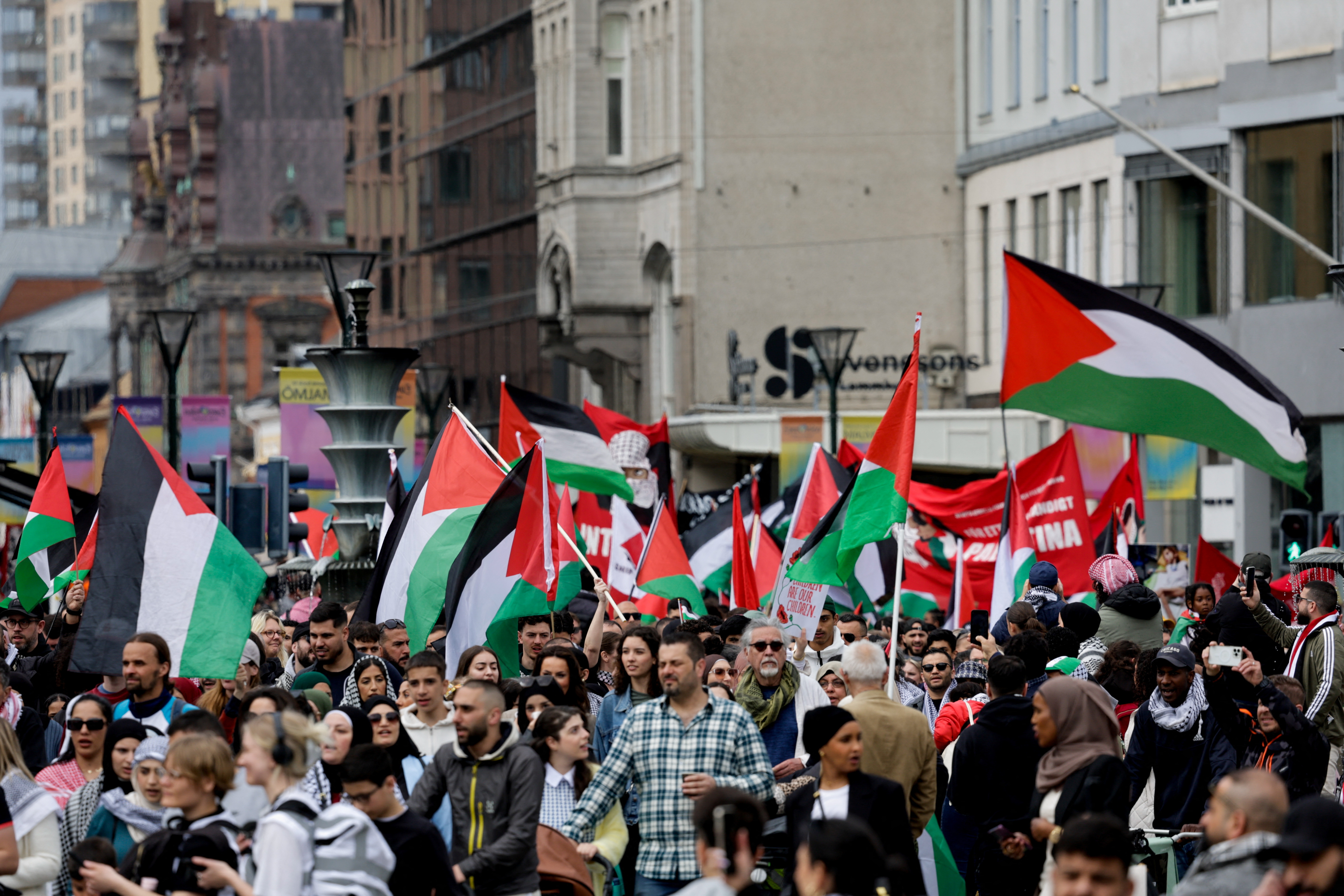People hold Palestinian flags during a protest against Israeli participation in the Eurovision Song Contest