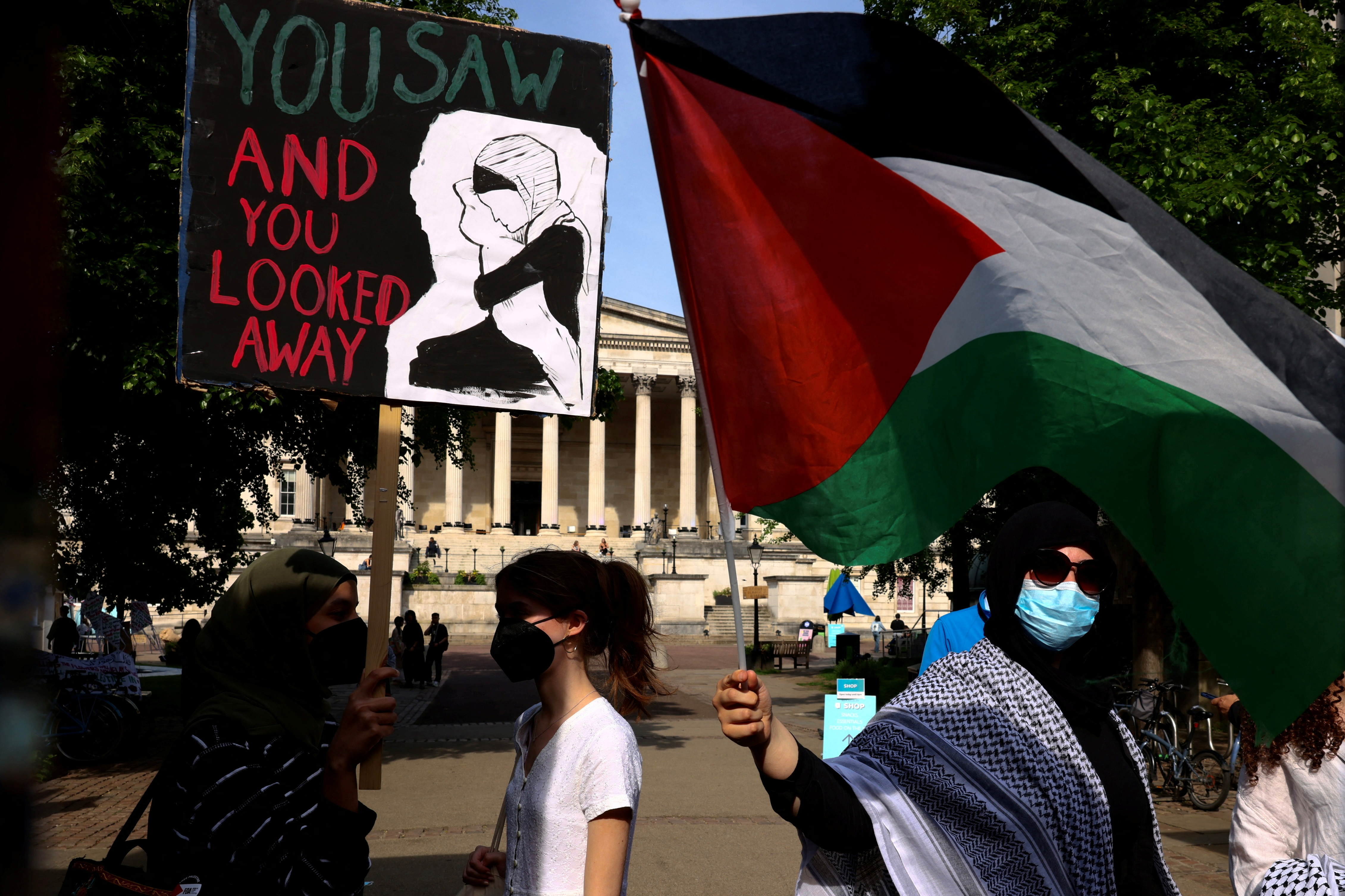 People take part in a protest at University College London in support of Palestinians in Gaza,