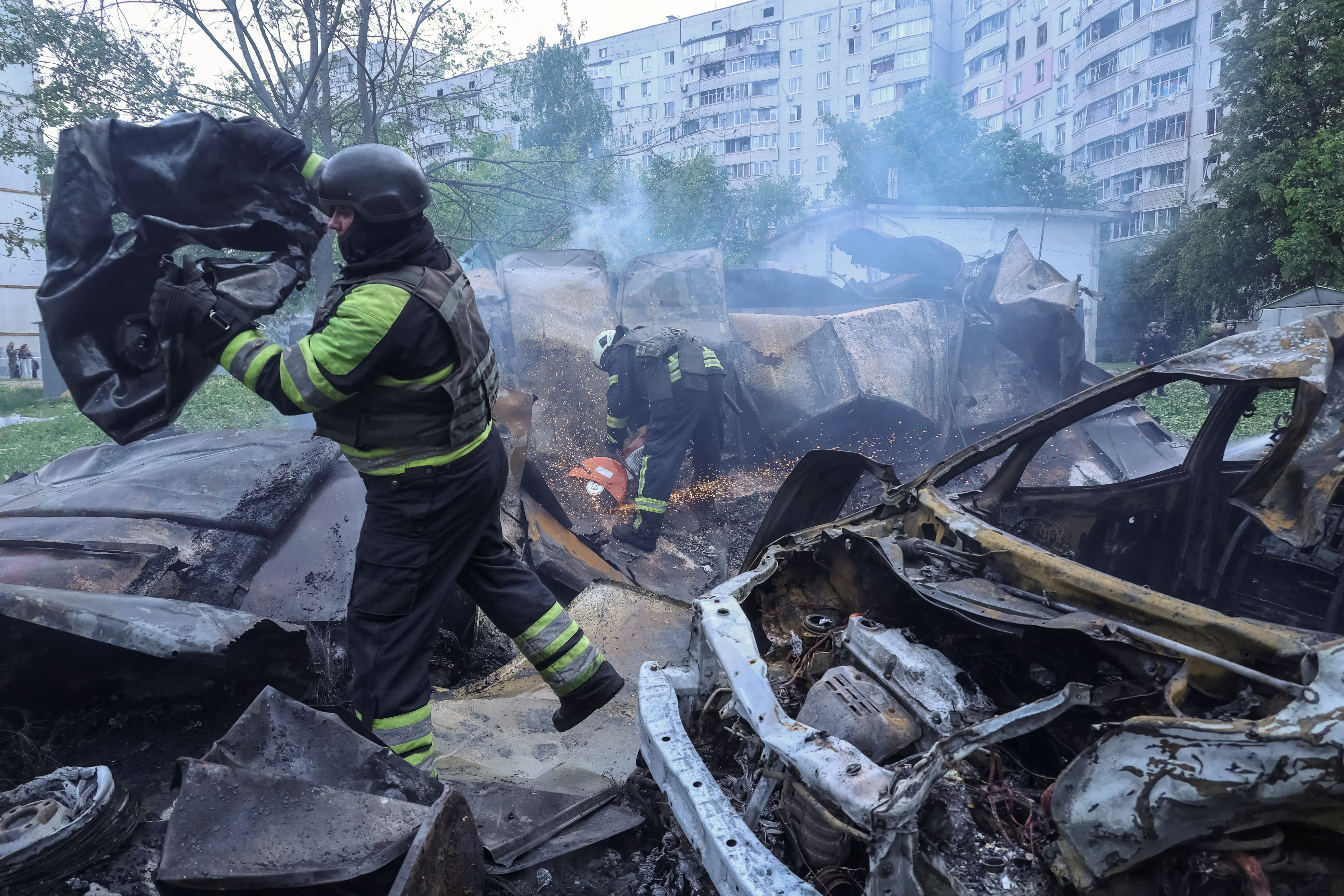 Firefighters work at the site of a Russian air strike, amid Russia's attack on Ukraine, in Kharkiv, Ukraine May 14, 2024. REUTERS/Sofiia Gatilova