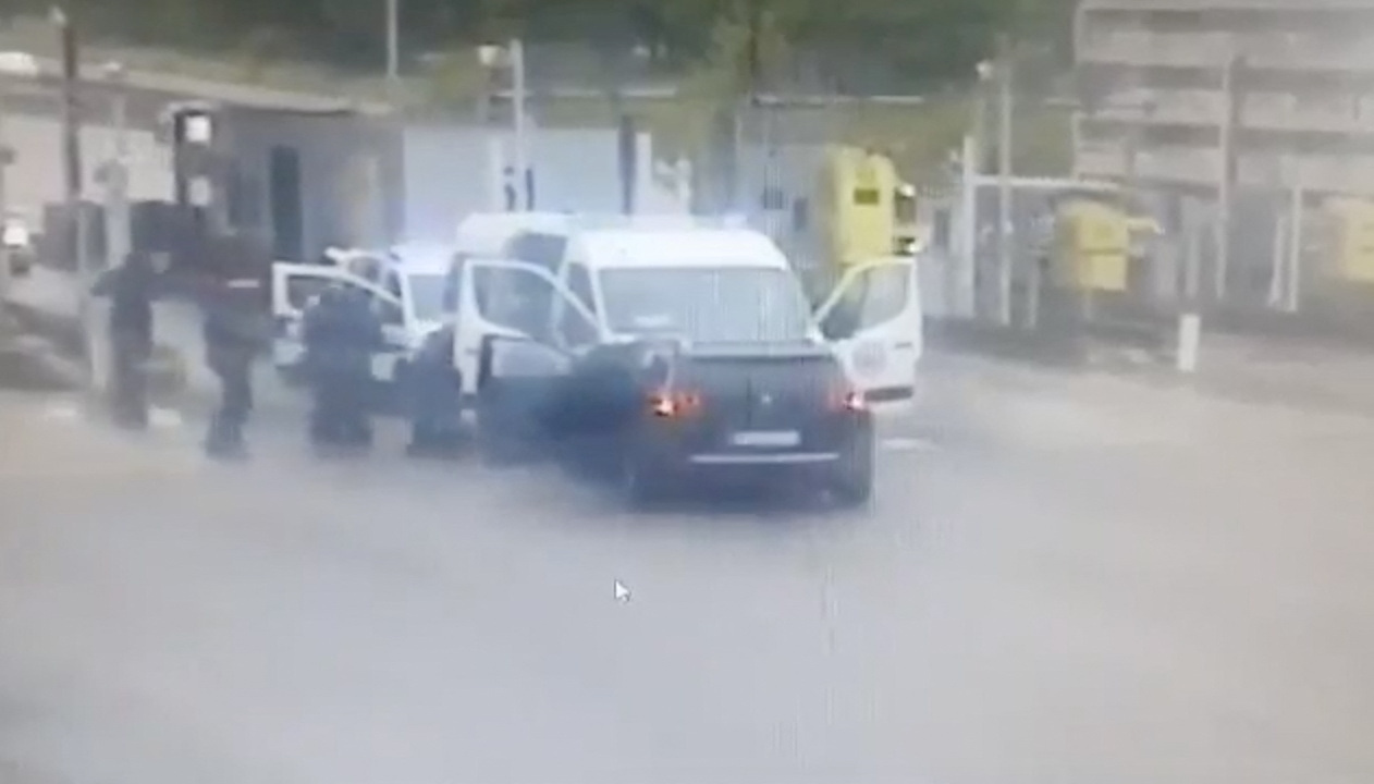 A screen grab from a CCTV video shows gunmen wearing balaclavas ambushing a prison van to free a drug dealer in Val-de-Reuil