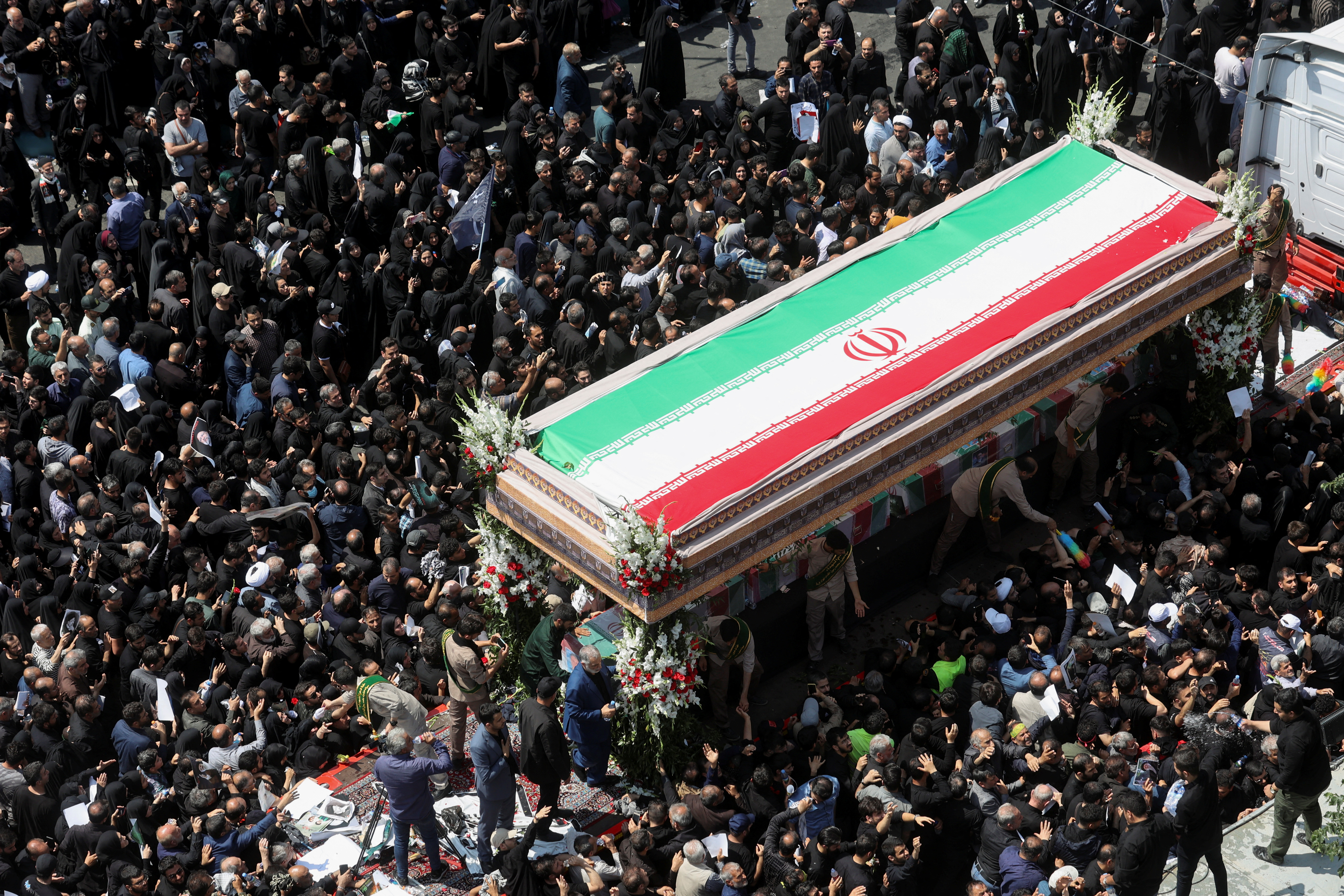 Mourners attend the funeral of Iranian President Ebrahim Raisi,