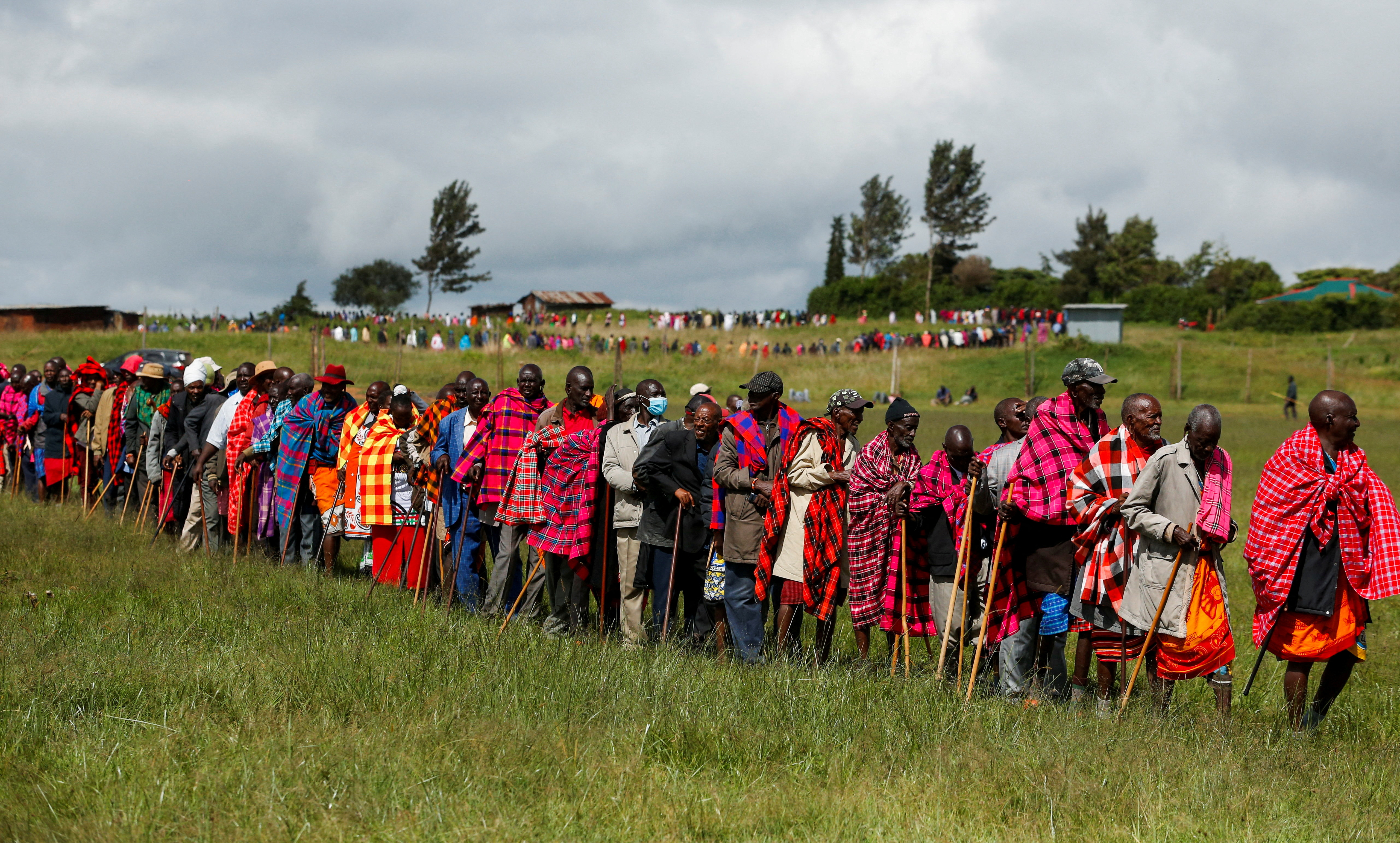 Members of Indigenous Maasai, who are members of the Keekonyokie Community Trust, attend a "mlolongo" queue to vote in the Trust's leadership elections, before dividing the 2,800-acre prime land in Kibiko near Ngong in the outskirts of Nairobi, Kenya May 24