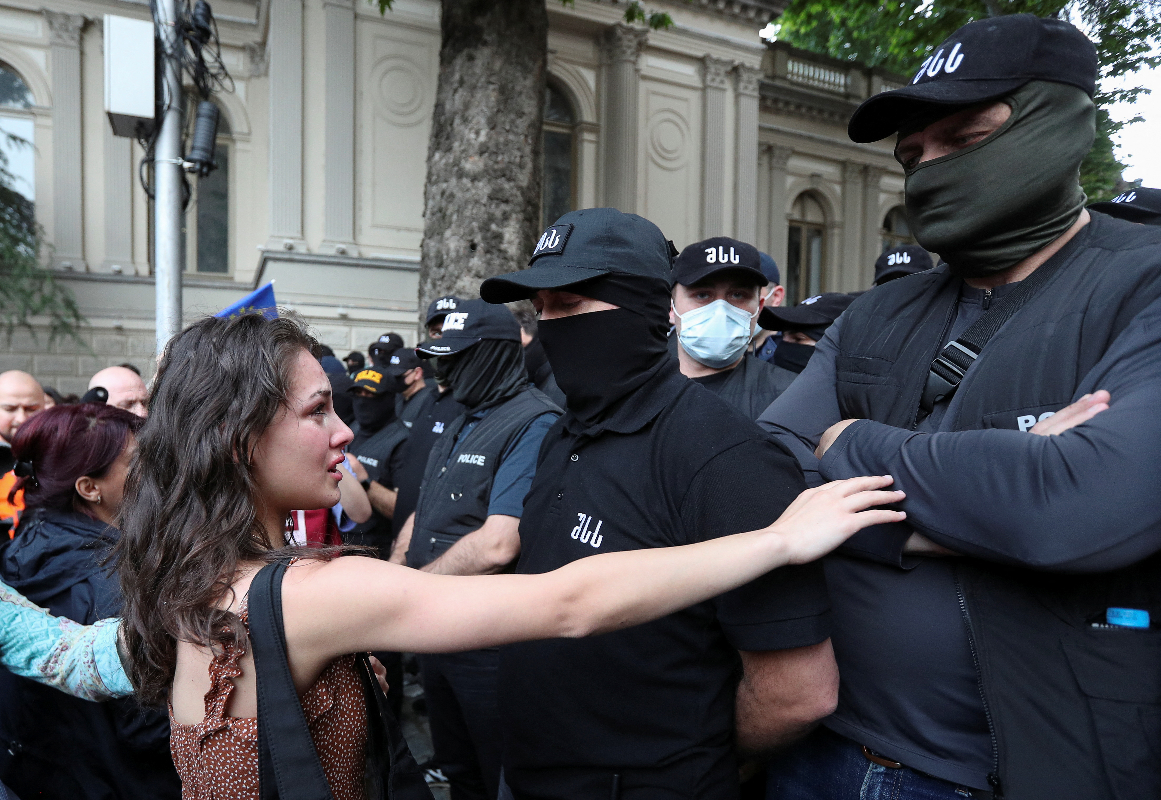 Demonstrators stand in front of law enforcement officers during a rally to protest against a bill on "foreign agents", after Georgia's parliament voted to override a presidential veto of the bill, in Tbilisi, Georgia, May 28, 2024. REUTERS/Irakli Gedenidze