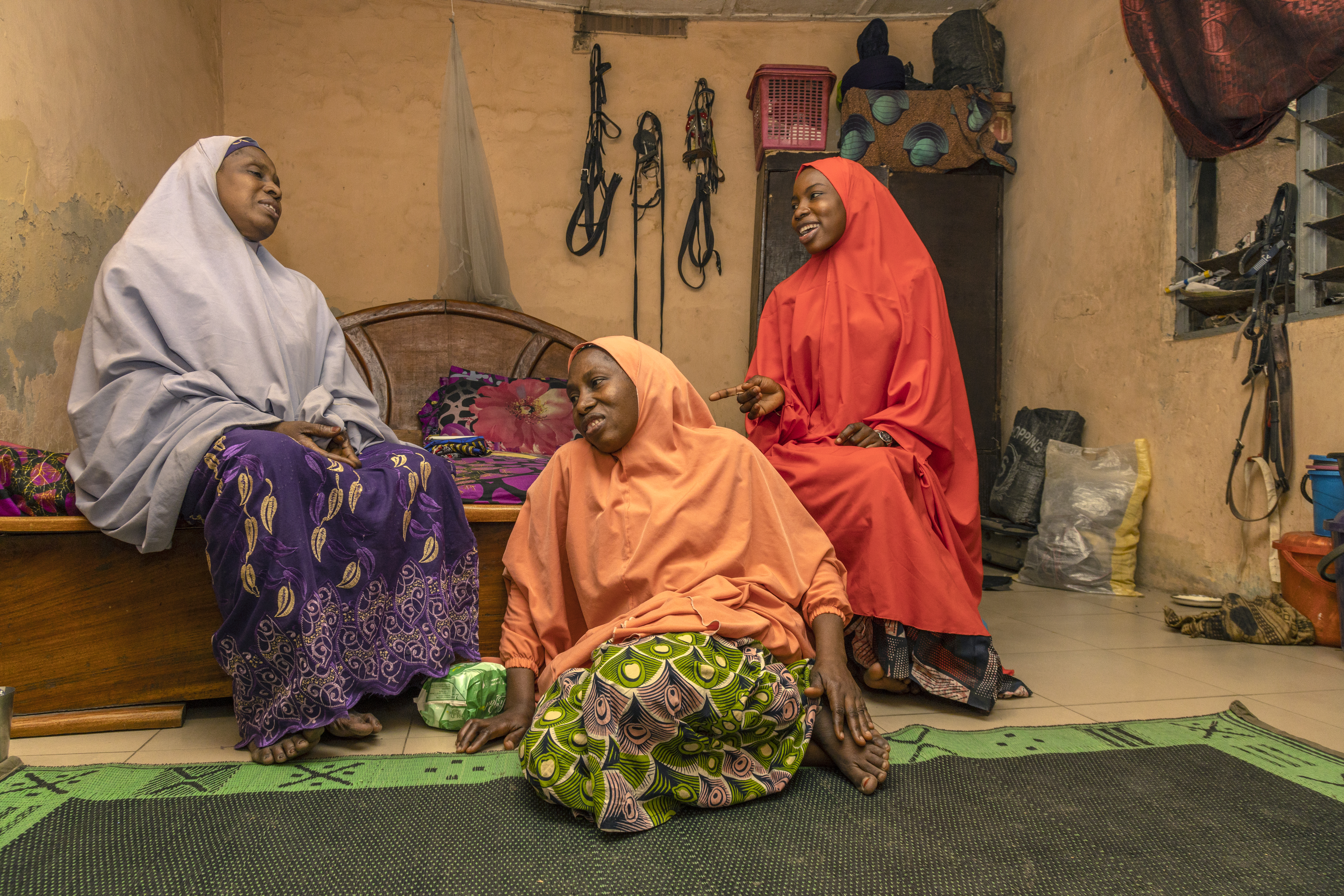 Rahamatu, 19, (pictured right) with her mother, ‘mama’ Sakina, (left) and her grandmother, also Rahamatu but known as ‘Kaka’, 58, (centre), at home in Bauchi, Nigeria.