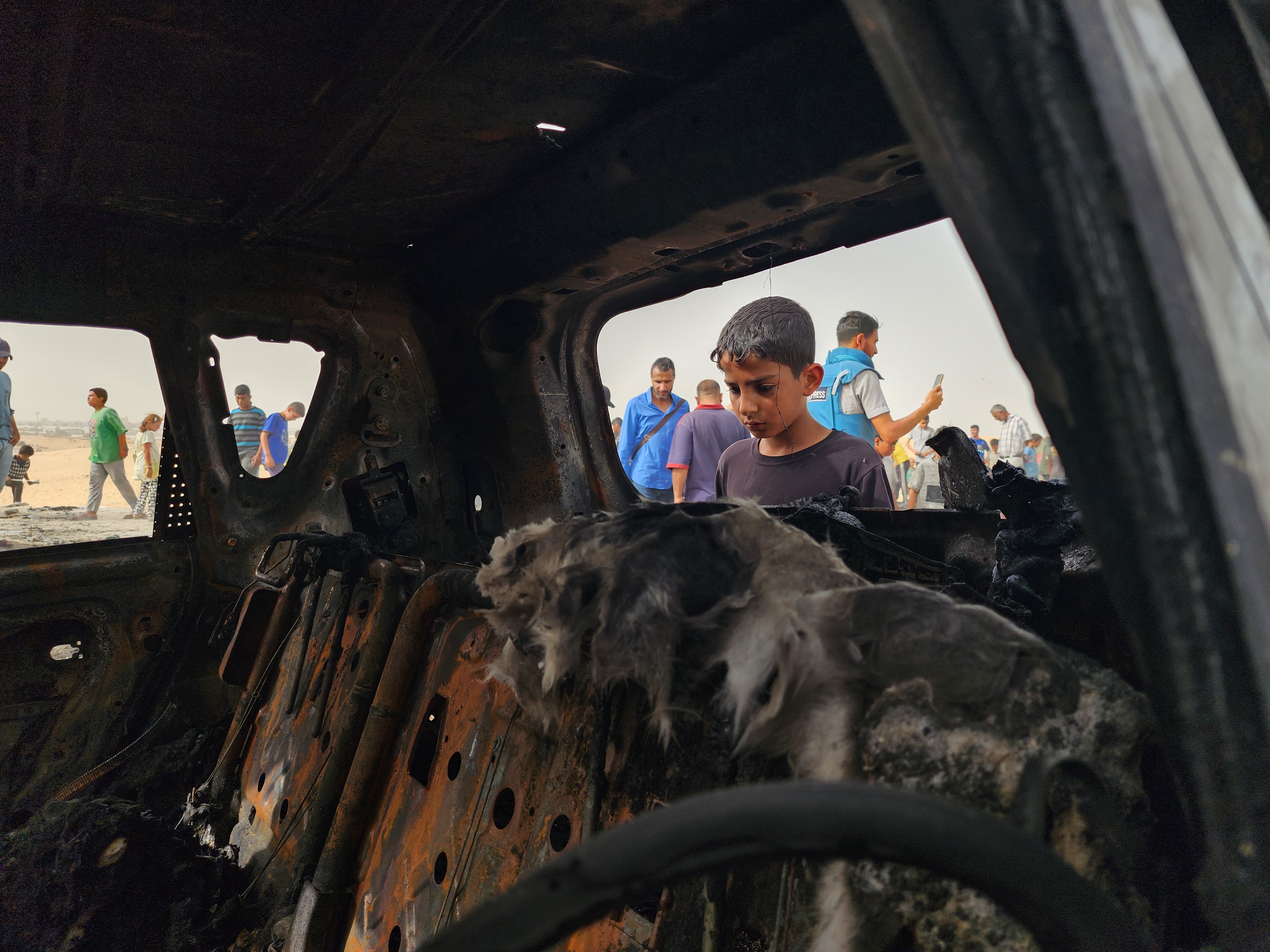 A Palestinian child view the destruction 