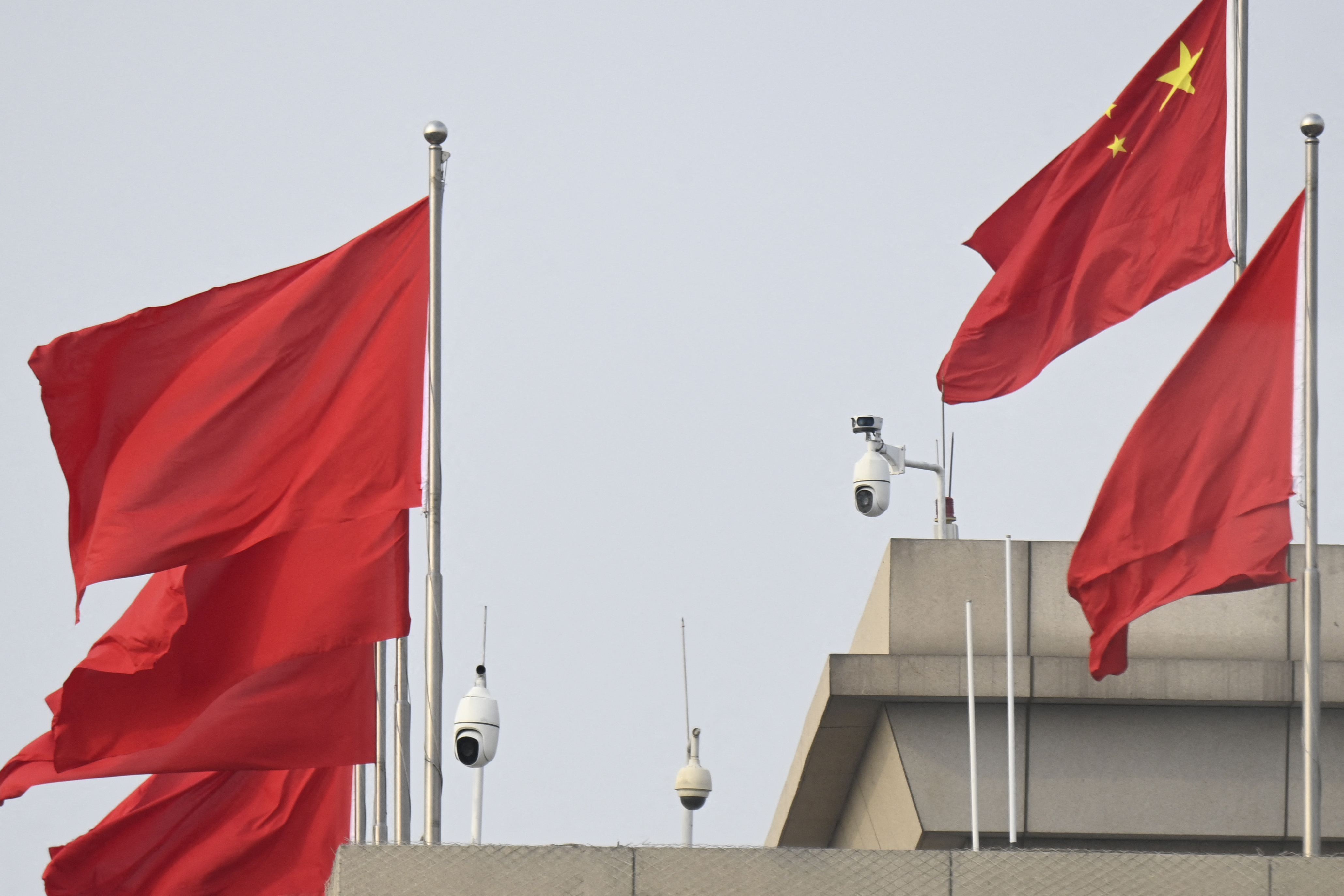 Chinese flags and surveillance cameras