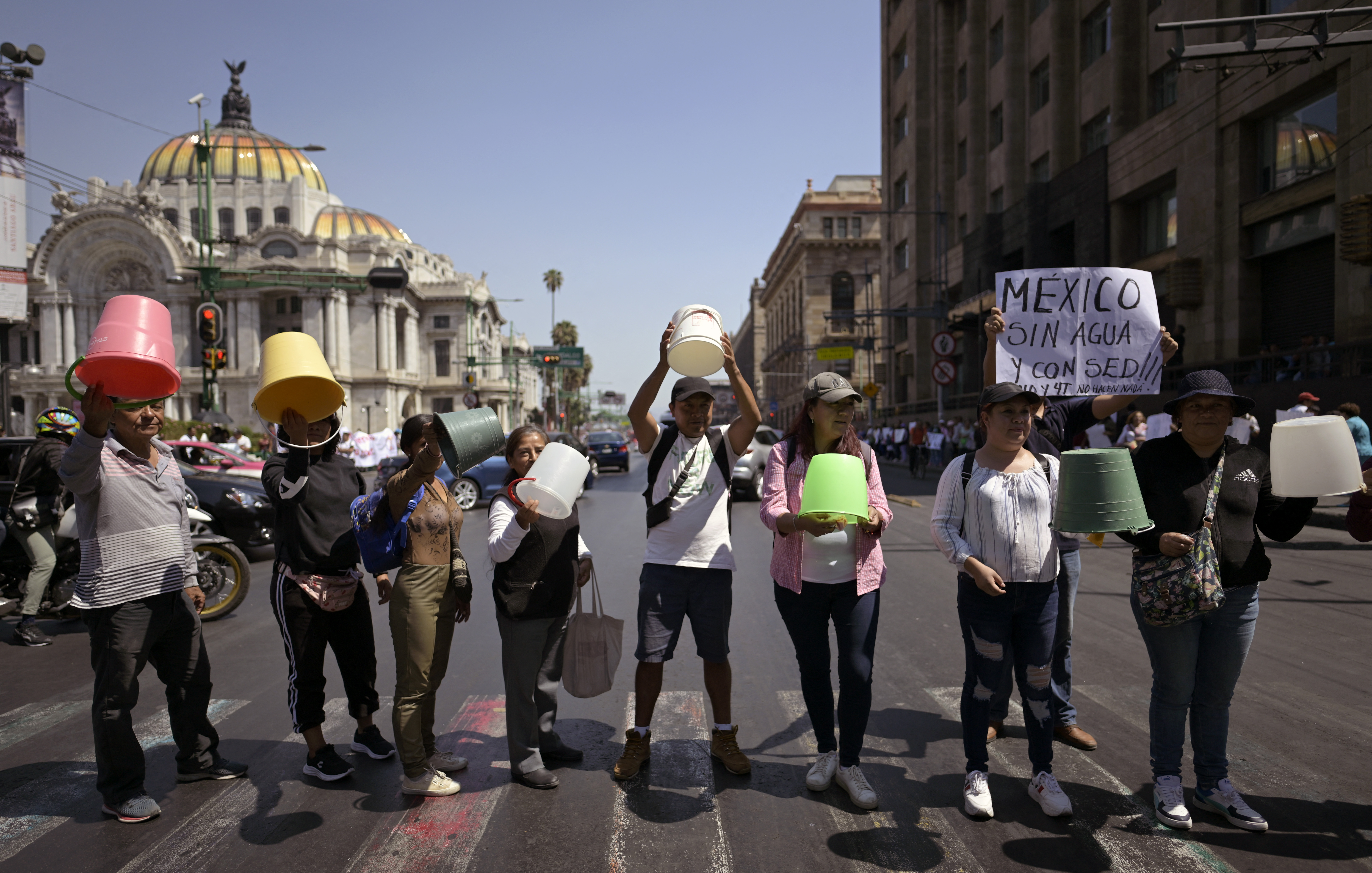 Members of the political organization Antorcha Campesina demonstrate against the lack of water in different areas of Mexico, in Mexico City on April 3, 2024. - The problem of water shortages in Mexico, which afflicts both the capital and other states and is aggravated by the heat wave, is beginning to break into the campaigns for the general elections. Less than three months before the June 2 elections and the rainy season, the capital and its suburbs, with more than 20 million inhabitants, have been suffering since January from constant water shortages in many neighborhoods, forcing many to install huge water tanks or build cisterns to store water. (Photo by ALFREDO ESTRELLA / AFP)