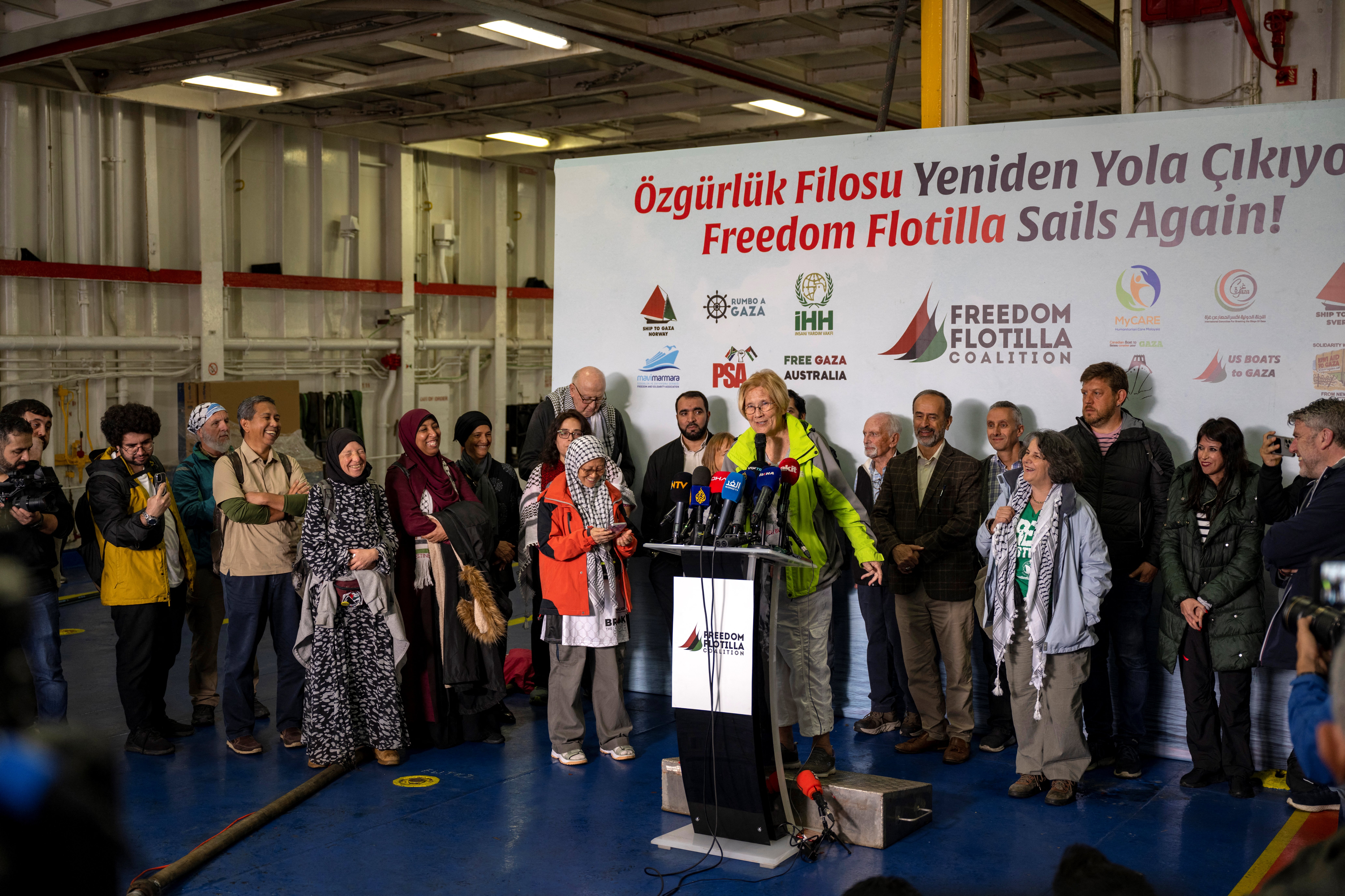 Activists hold a press conference inside a ship belonging to the Freedom Flotilla Coalition while it anchors in the Tuzla seaport, near Istanbul on April 19, 2024