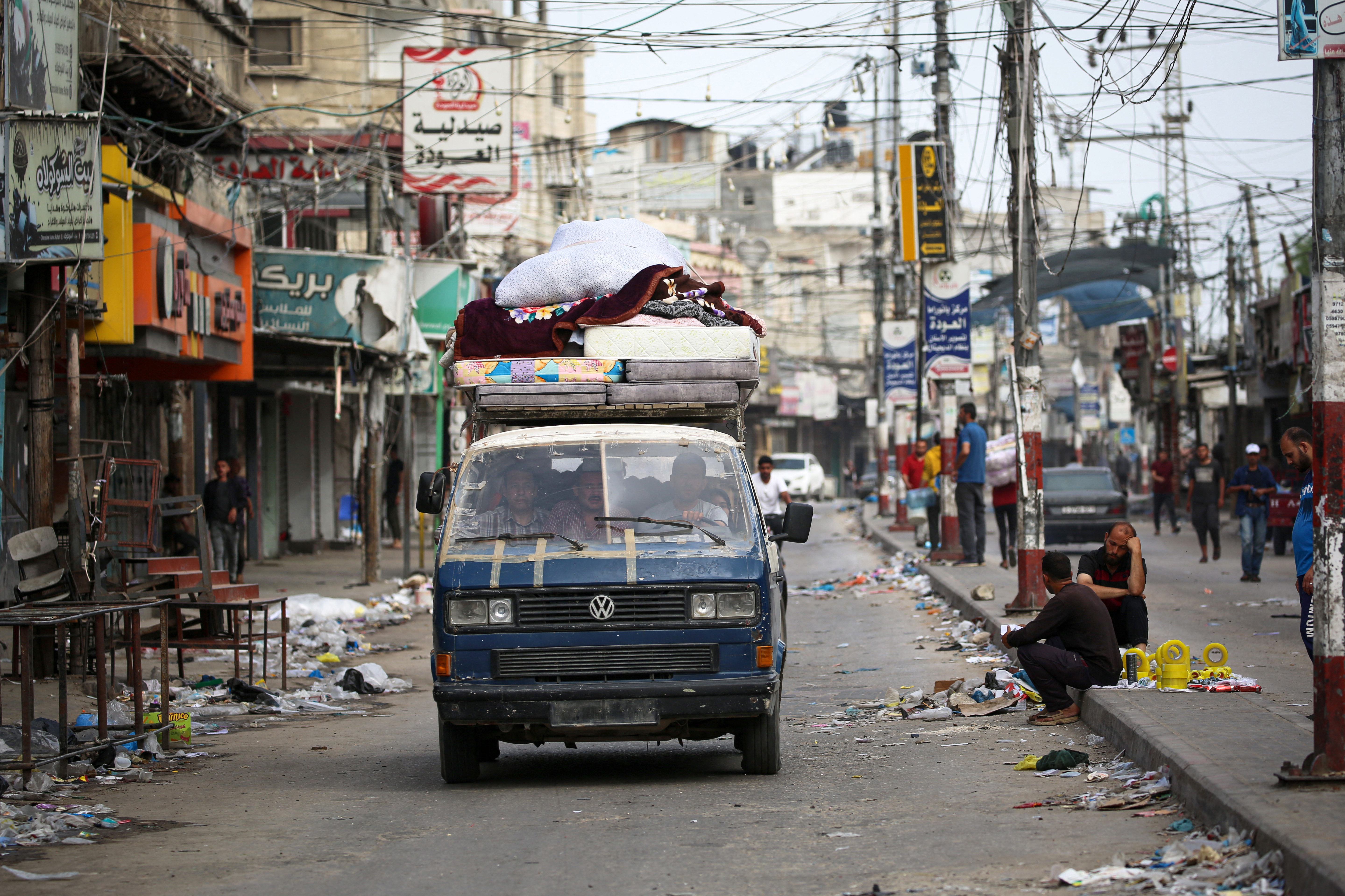 Palestinians transport their belongings on the back of a van as they flee Rafah in the southern Gaza Strip to a safer location on May 11