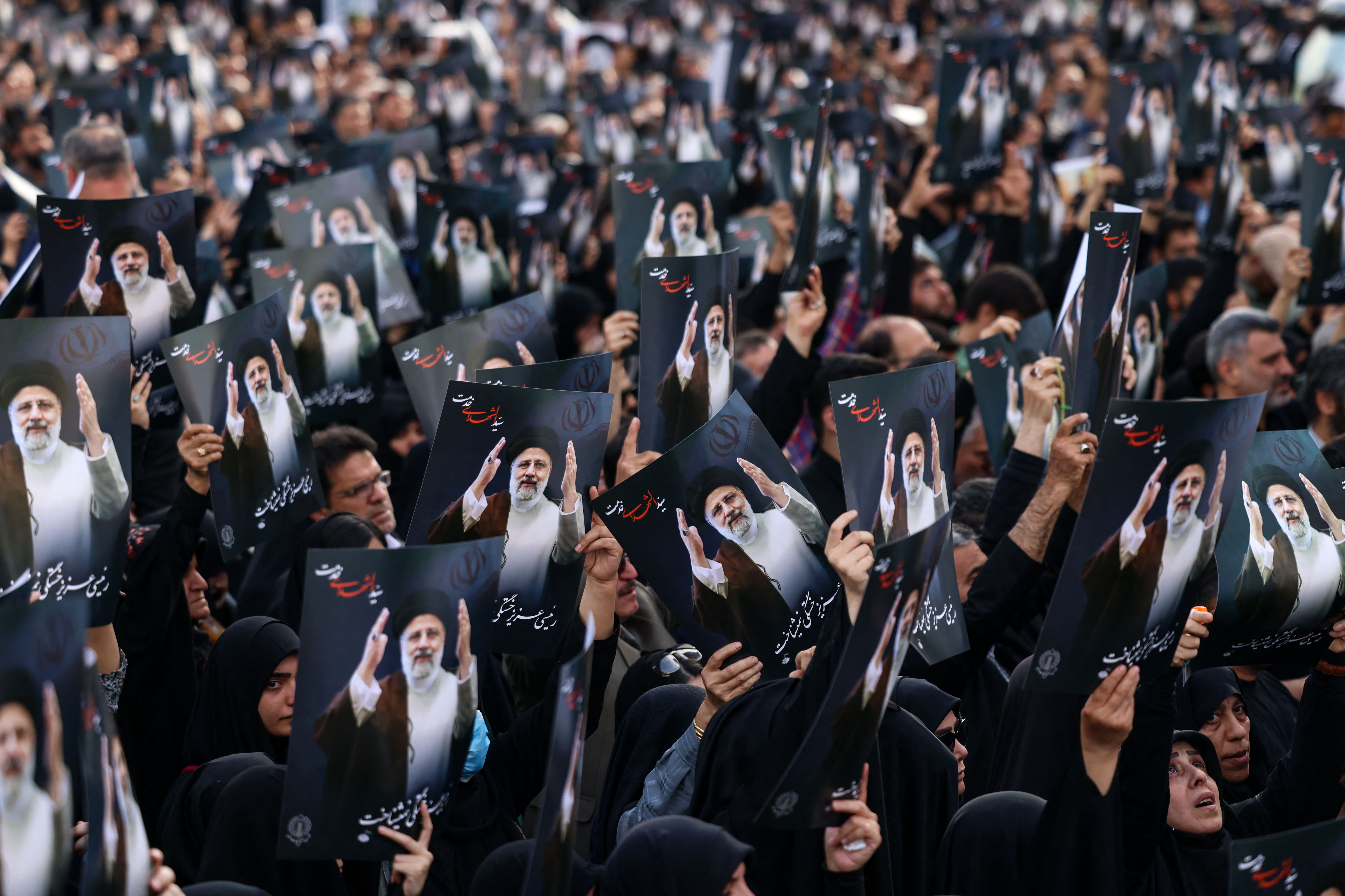 Iranians gather at Valiasr Square in central Tehran to mourn the death of President Ebrahim Raisi and Foreign Minister Hossein Amir-Abdollahian in a helicopter crash the previous day, on May 20
