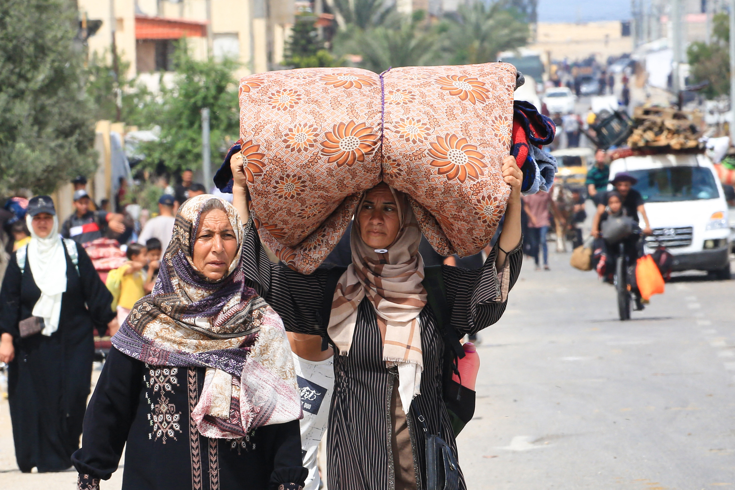 Palestinians flee the area of Tal al-Sultan in Rafah