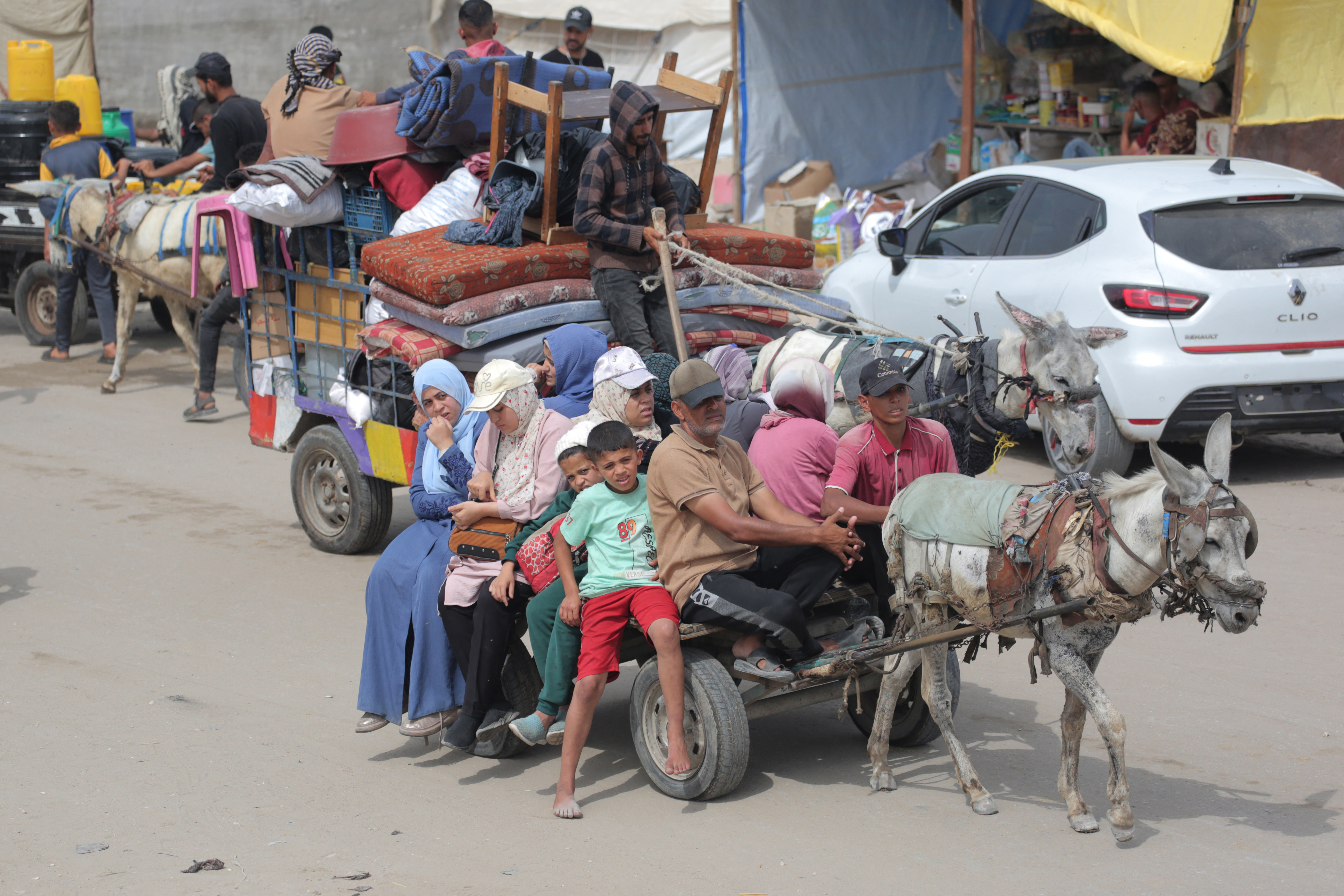 Palestinians flee the area of Tal al-Sultan in Rafah