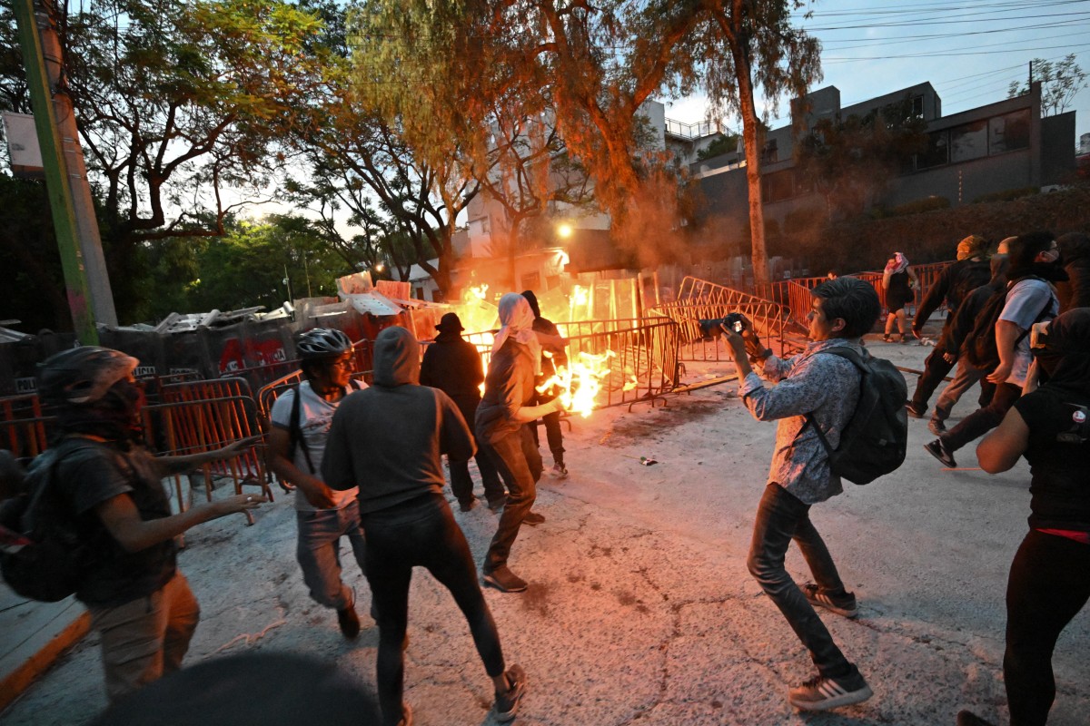 Demonstrators clash with the police during a pro-Palestinian rally called "Urgent action for Rafah"