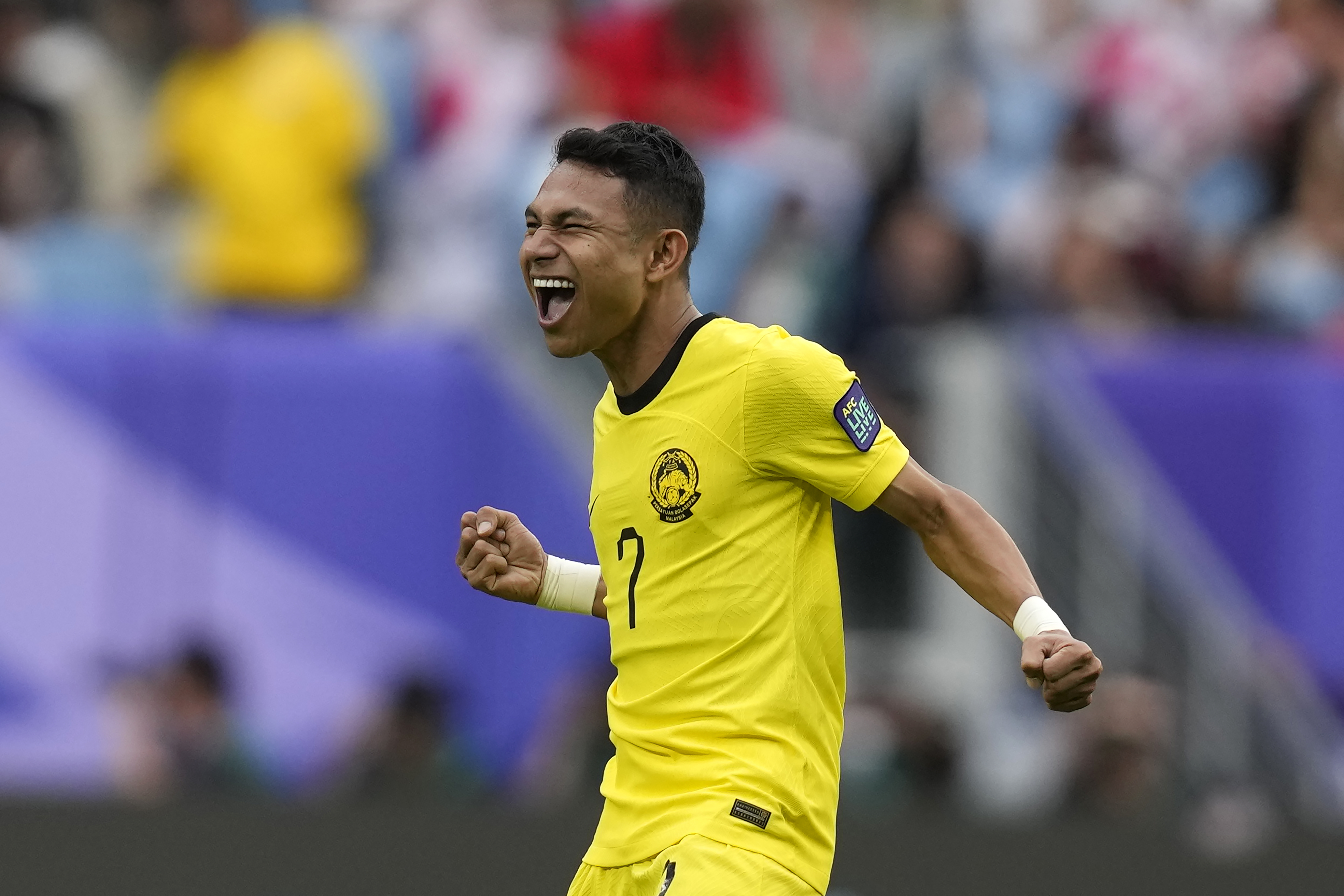 Malaysia's Faisal Halim celebrates after scoring his side's first goal during the Asian Cup Group E soccer match between South Korea and Malaysia at Al Janoub Stadium in Al Wakrah, Qatar, Thursday, Jan. 25, 2024. (AP Photo/Thanassis Stavrakis)