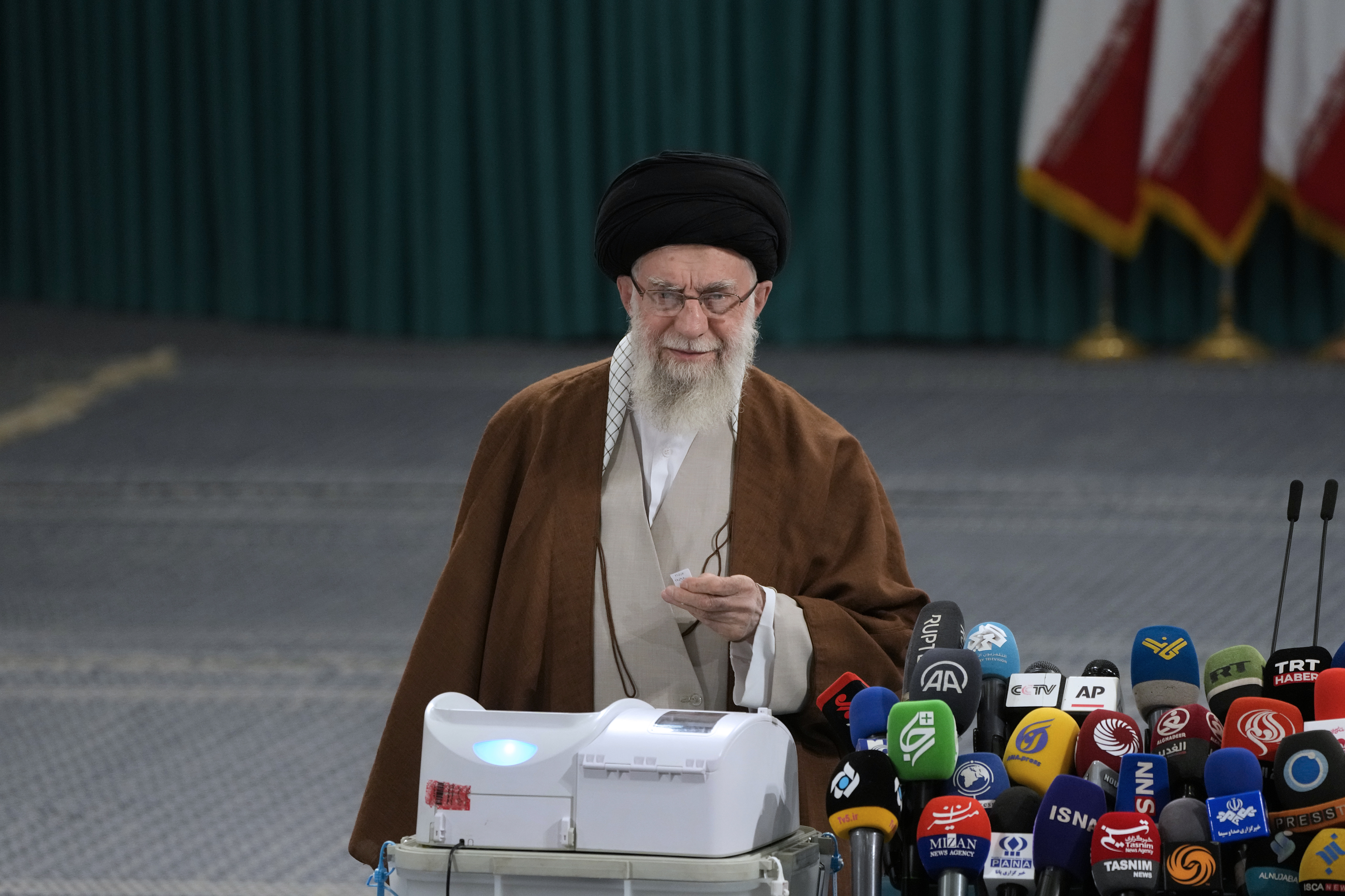 Iranian Supreme Leader Ayatollah Ali Khamenei votes for the parliamentary runoff elections, in Tehran, Iran, Friday, May 10, 2024. (AP Photo/Vahid Salemi)