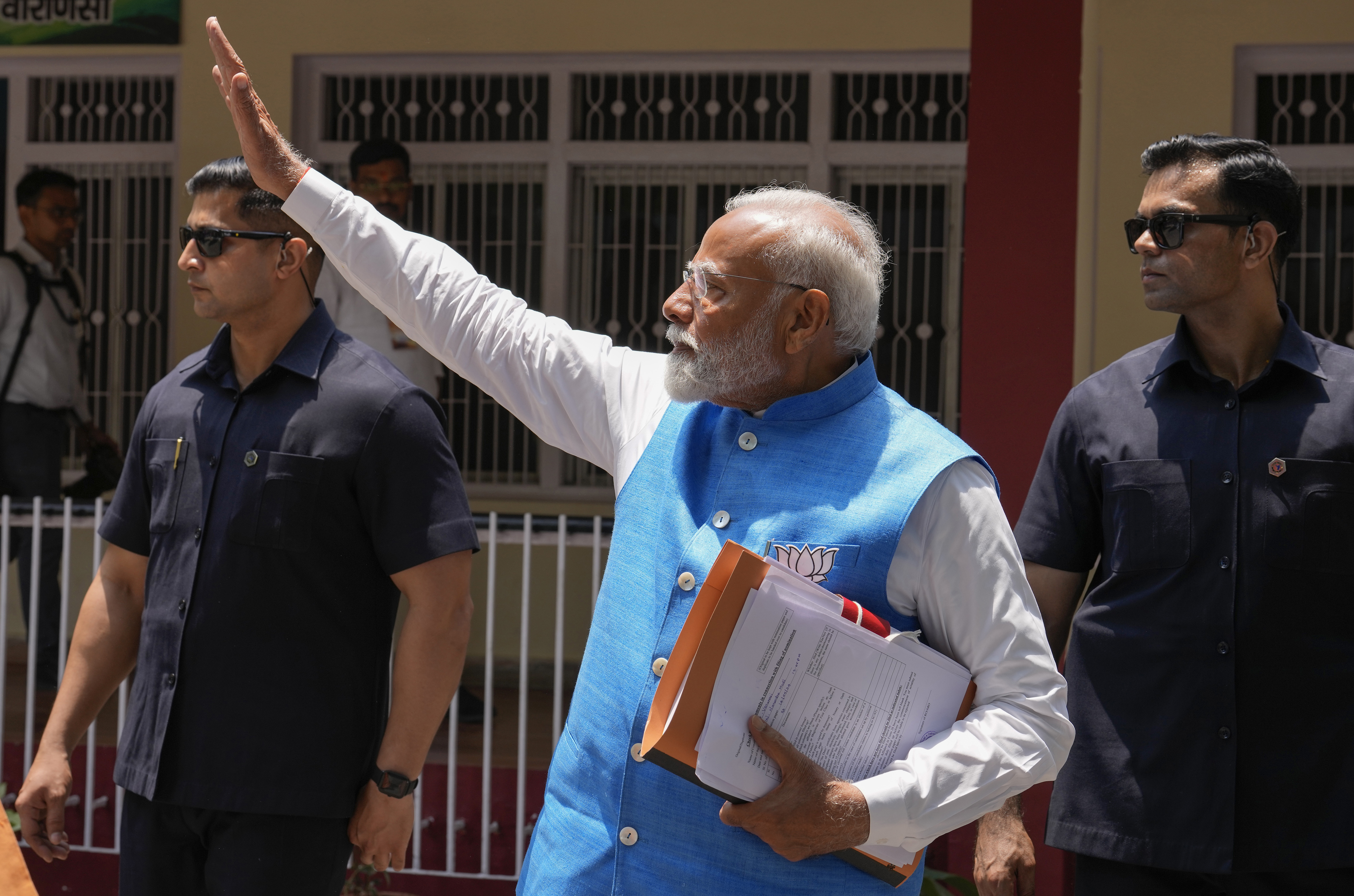 Indian Prime Minister Narendra Modi, waves to the public as he returns after filing his nomination papers to contest as a candidate for the parliamentary elections in Varanasi, Uttar Pradesh state, India, Tuesday, May 14, 2024. Varanasi will go to polls on June 1 in the seventh and last phase of the six-week-long election. (AP Photo/ Rajesh Kumar Singh)