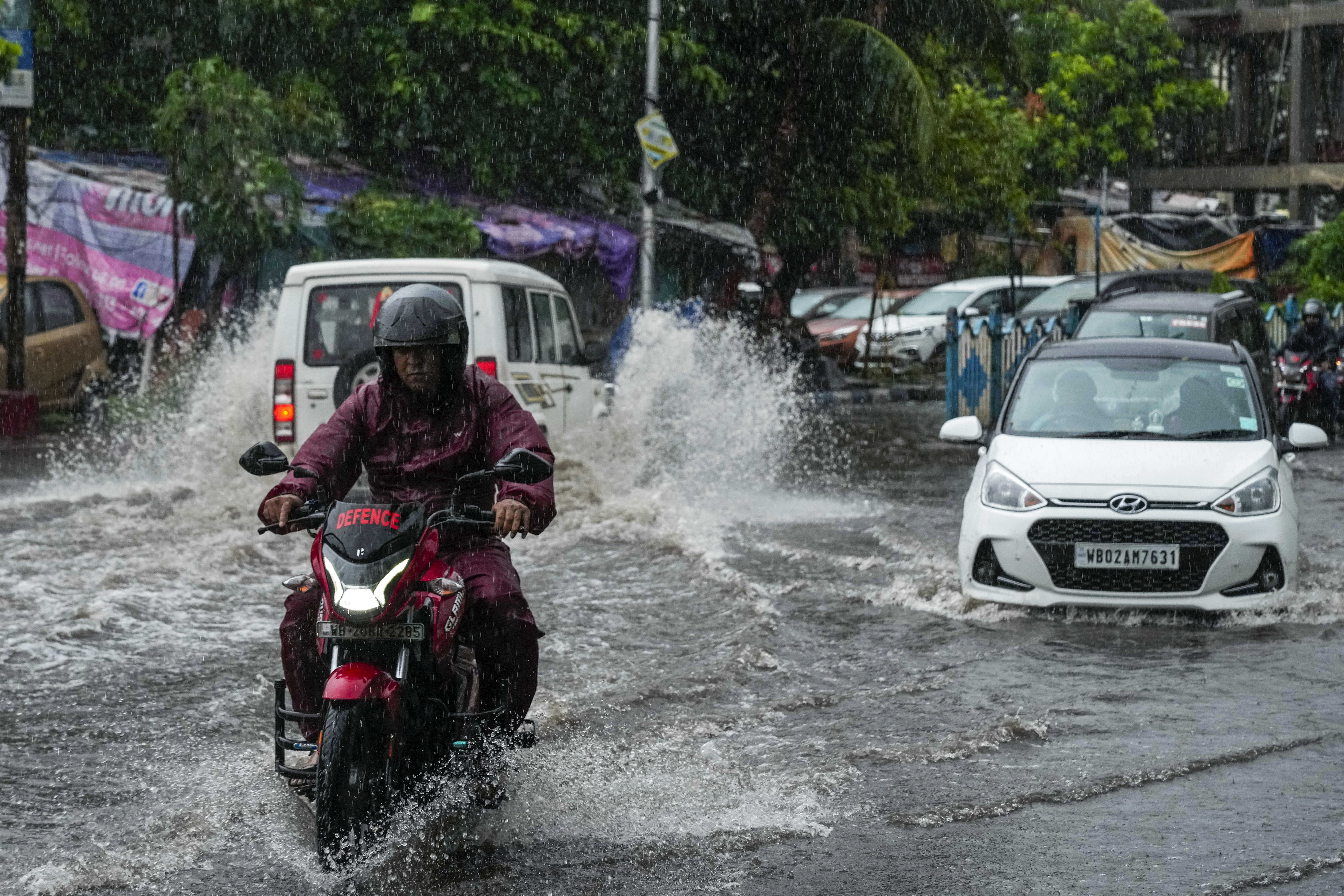 Cyclone blows away thatched roofs and cuts power in Bangladesh and India