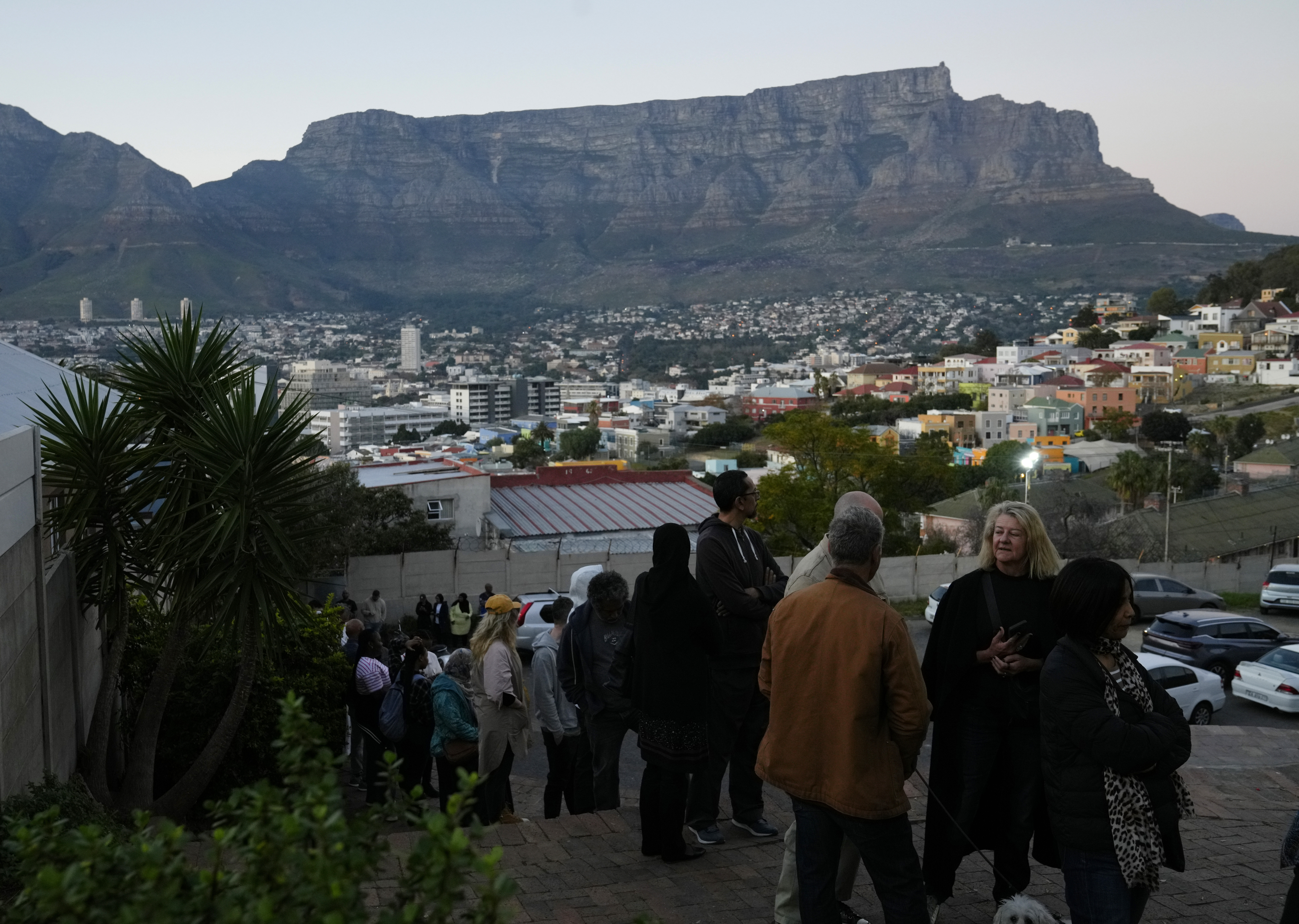 People queue to cast their votes at a polling station during general elections, in Cape Town