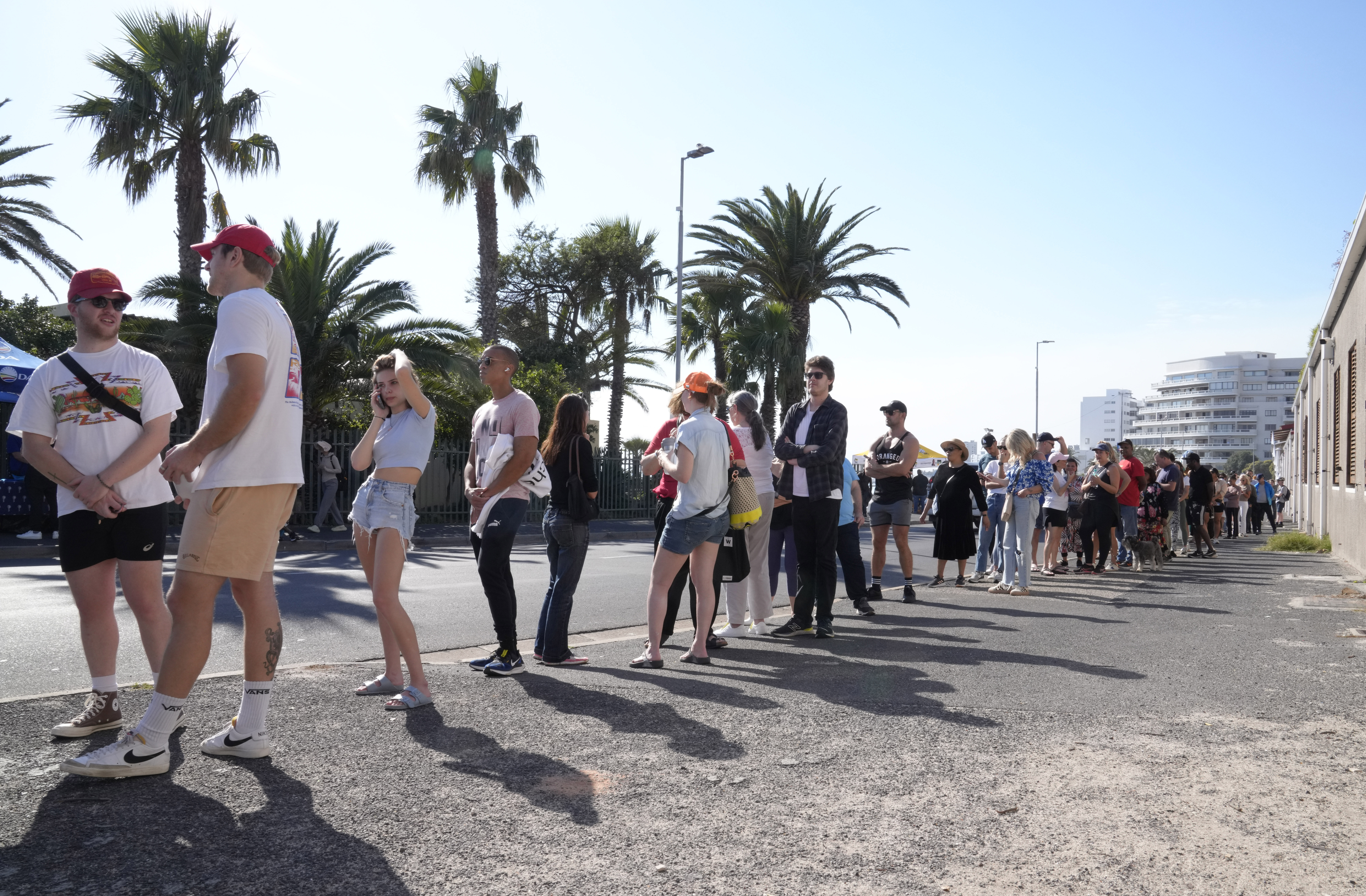 People queue to cast their votes at a polling station in Cape Town, South Africa