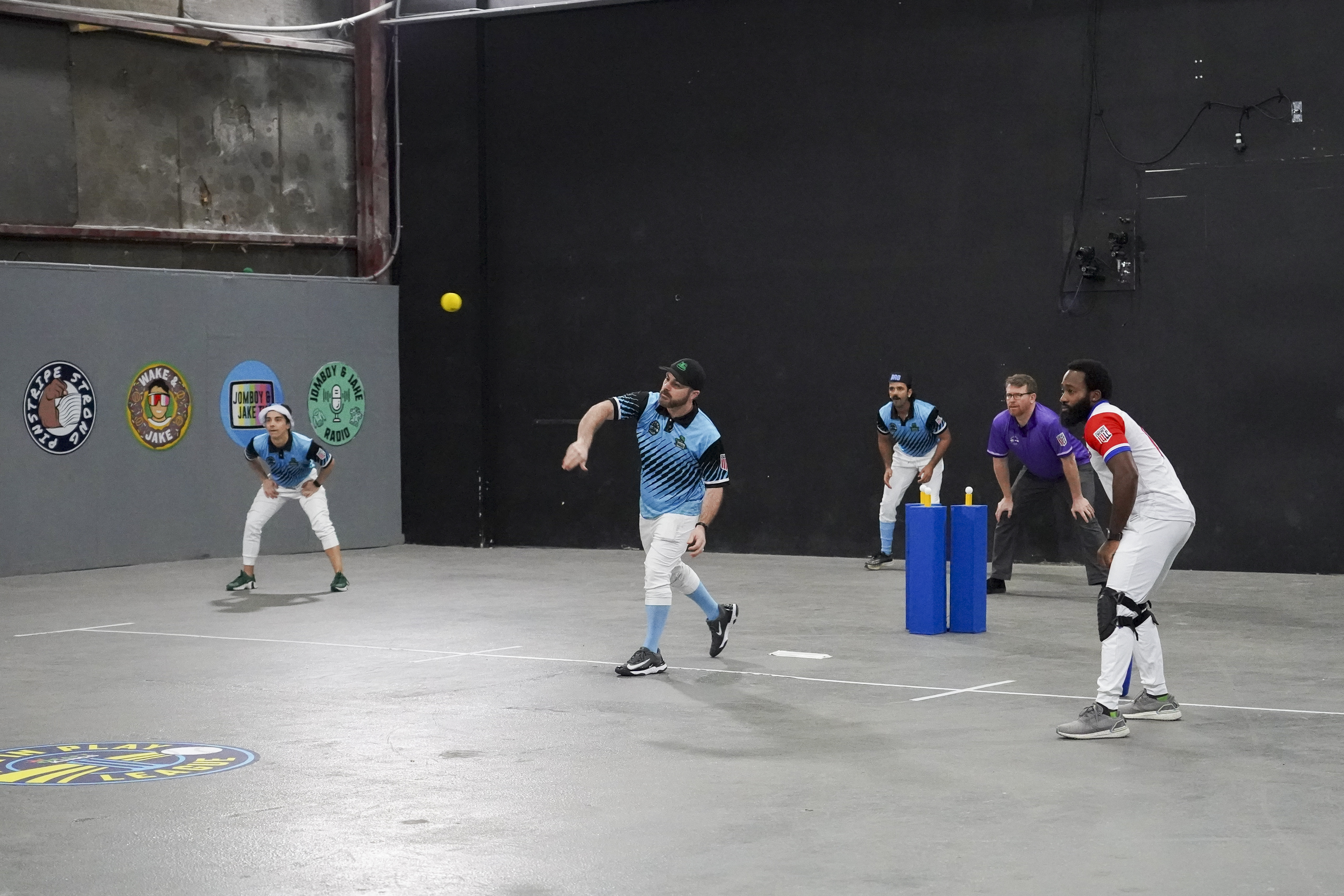 Jimmy O'Brien 'bowling' for Team Baggage in Ball in Play, held in a New Jersey warehouse [Courtesy: Jomboy Media]