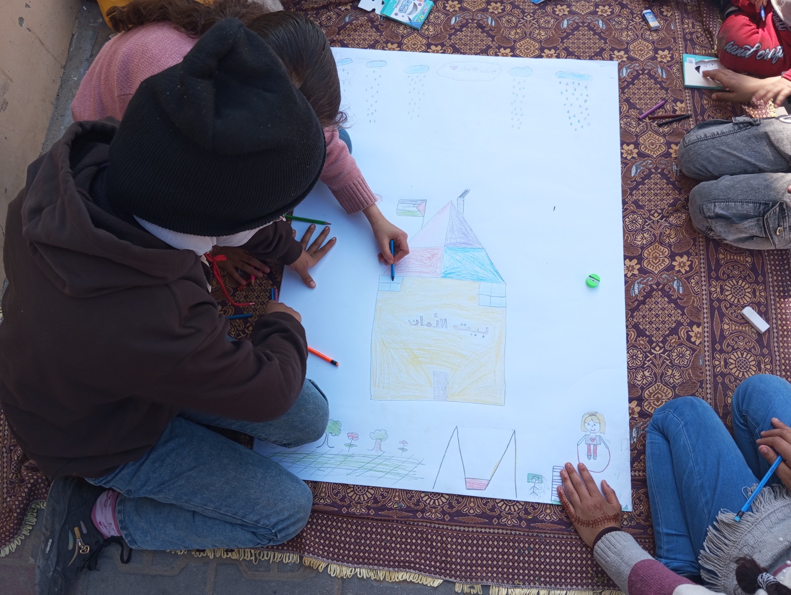 “They painted safe homes, loving families and beautiful green gardens,” organisers from the Culture and Free Thought Association say. “They painted their desire for normality, stability and security, and their dreams of a better future free from violence and destruction."