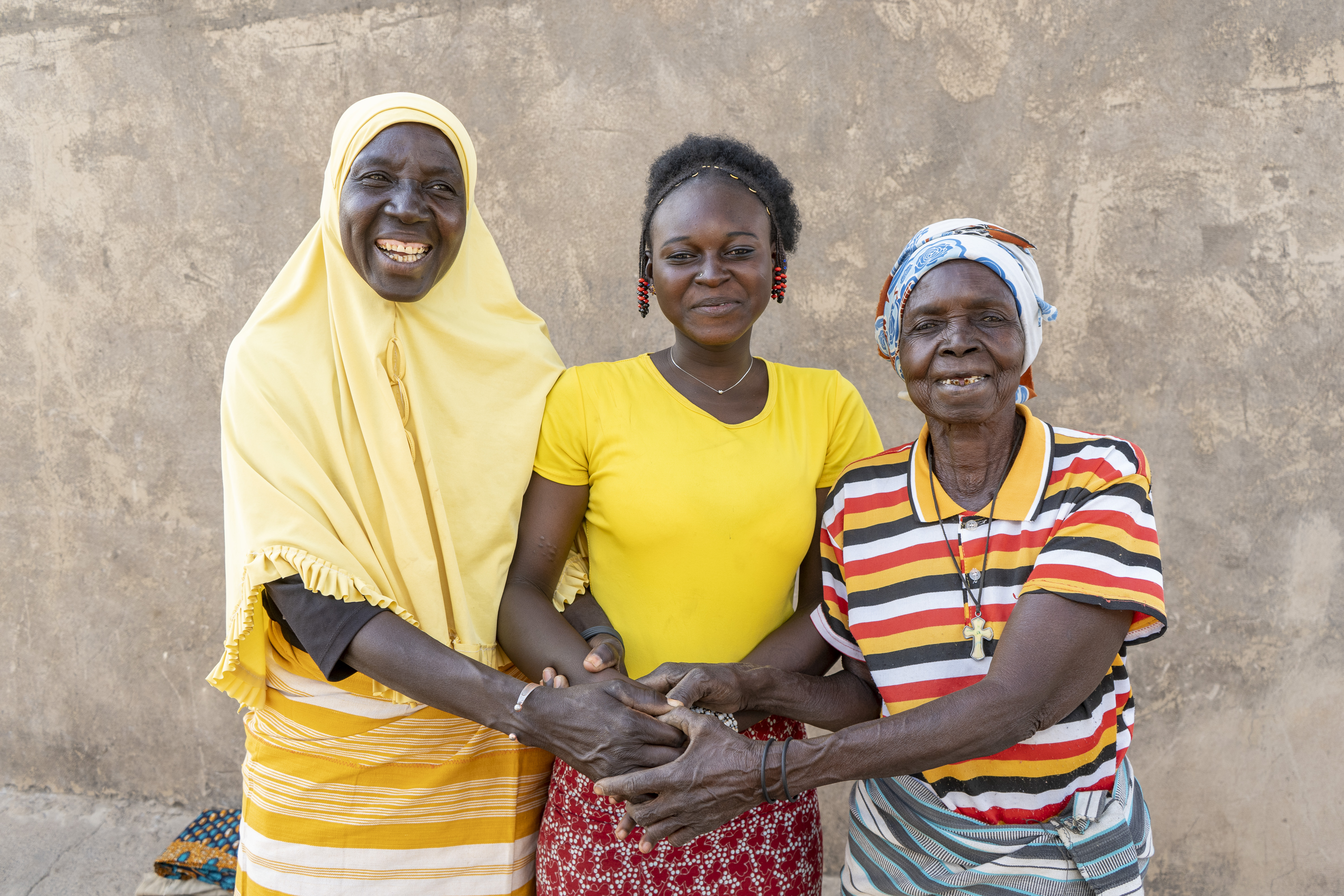 Burkinabé grandmother Marie, 76, with her daughter, Aminata, 60, and teenage granddaughter, Nassiratou, 18 — known affectionately as Nassi — at home in west-central Burkina Faso